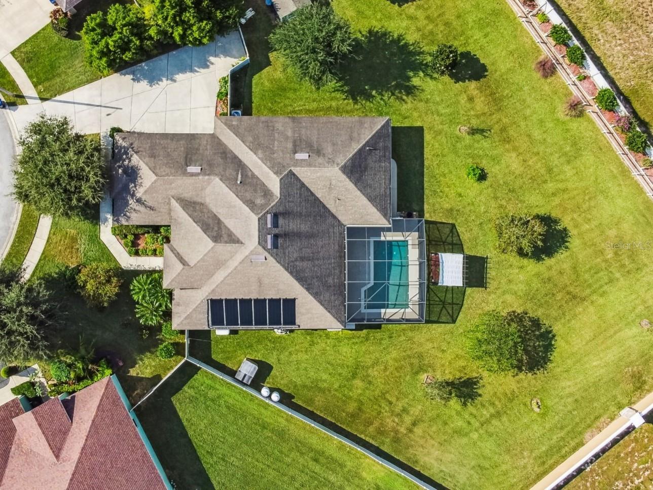 Welcome to the Hills of Arietta! This stunning 2,736 sq foot pool home offers the perfect blend of luxury and privacy. Ideally situated in a beautiful, gated community, this property is a must-see for buyers looking for a spacious and modern residence in Central Florida.
This 3-bedroom, 3-bath home sits on a beautifully landscaped oversized .6 acre lot! It is situated on a quiet culdesac and fenced in for complete privacy. From the moment you enter the front door, the spacious living and formal dining room are enhanced by a soaring 12 foot ceiling. The light-colored interior is enhanced by plenty of natural light with large windows and French doors that lead to a huge screened in patio and pool with a relaxing waterfall feature - perfect for entertaining!
This home has so many extras! From the plantation shutters throughout, solar panels to heat the pool, whole home generator to ensure that you stay comfortable in the event of power loss and a security system. 
The left side of the home is perfect as a in-law suite as it has a private access door, 2 bedrooms with a connecting bonus room and 2 bathrooms. Or it’s perfect for children as the bonus room provides extra space for a playroom or study.
The large 3-car garage has plenty of storage with hanging metal racks for extra storage. The backyard also provides two sheds for lawn equipment and pool supplies, and plenty of room to park a boat.