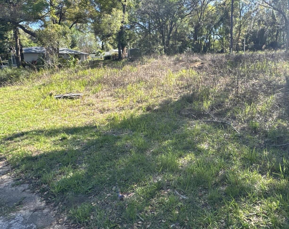 Cleared and ready for immediate construction – this lot comes with approved permits and all construction fees already paid. Ideally located on a well-maintained paved road, with public water and electricity available at the street. It offers a smooth path to fast development. With all documentation approved, the new owner can break ground quickly and start building the pre-approved home without delay. Don’t miss this opportunity!