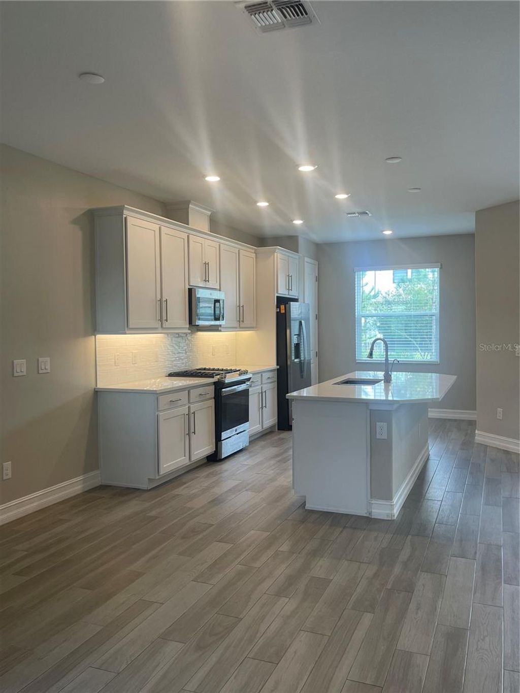 Photo of 4596 Almada Lane, Wesley Chapel, FL 33543 (MLS # TB8437166)