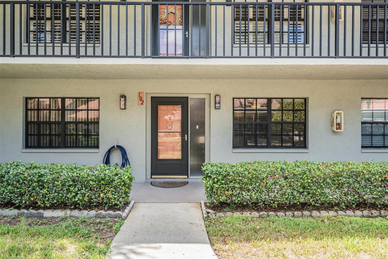Welcome to Easy Living in the Villas of Lake Arbor!
Enjoy the comfort and convenience of this ground-floor 2-bedroom, 2-bath condo in the highly sought-after 55+ community. This maintenance-free, pet-friendly neighborhood is located in a NO FLOOD ZONE and NO EVACUATION ZONE, offering peace of mind and stress-free living. No milestone inspection required for this two-story building. Covered carport parking right outside your door, along with many guest parking spaces.
As you step inside the foyer you are welcomed by the kitchen with a bright and inviting eat-in space, featuring plenty of cabinetry and counter space for all your cooking needs. The kitchen has an inviting eat in area. You'll also appreciate the convenient laundry closet with a stackable washer and dryer.
The pass-through open window to the dining room, is an efficient way to connect the two spaces while maintaining an open feel. A wet bar is also included, providing ample storage for your beverages and glassware. Step out to the generous Florida room through the living room and primary bedroom sliders. It offers an ideal space for outdoor relaxation or office space. Both bedrooms are generously sized, with the primary bedroom featuring its own private en-suite bathroom for comfort and convenience. The second bathroom is easily accessible for guests and is located just off the main living areas. This condo offers both comfort and style in a well-maintained, friendly community. The amenities include a lakefront heated pool with clubhouse, an outdoor cooking area, and fishing dock. The monthly maintenance covers cable, internet, trash, water, private road, heated pool, grounds maintenance, roof, building insurance and exterior providing a hassle-free lifestyle. Recent updates include a new electrical panel 2025, and roof 2024. Prime location for dining, shopping, and medical facilities. A short trip to our beautiful parks and glorious beaches! Call today for a private showing!