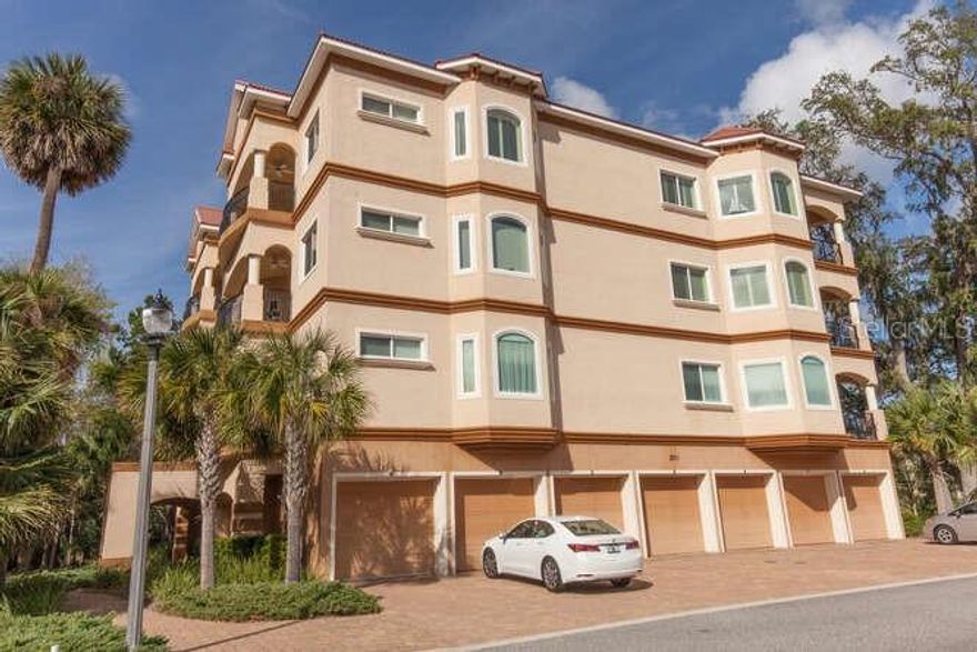 TOP FLOOR CORNER UNIT - Hammock at Palm Harbor- three bedroom/2.5 bath remodeled condominium with 2501 square foot on the top floor of a 4 story 7 unit building.  A truly exceptional unit with high ceilings, crown moldings, plus recent renovation with no carpet – tile and wood throughout plus new plantation shutters and newly painted interior.   Wonderful layout with Family room and breakfast nook off the kitchen plus a formal dining room and great room.  The master bedroom is large with ample space in the master bathroom allowing double vanities, walk-in shower and soaking tub.  Kitchen offers stainless steel appliances with granite counter tops and breakfast bar.  A light and bright unit with many windows plus two balconies – a wrap-around balcony plus a family room balcony to enjoy outdoor living with top floor exceptional breezes.  Split plan with 2 guest rooms that share a bath and half bath and laundry room.  Private elevator to your unit plus 1 car garage with access from the vestibule.  In addition, new washing machine, new garage door, handicap bars throughout, and more! The building exterior has been recently painted. Pool, fitness and social room in the community. Great location close to golf, shopping, medical, and the beach.