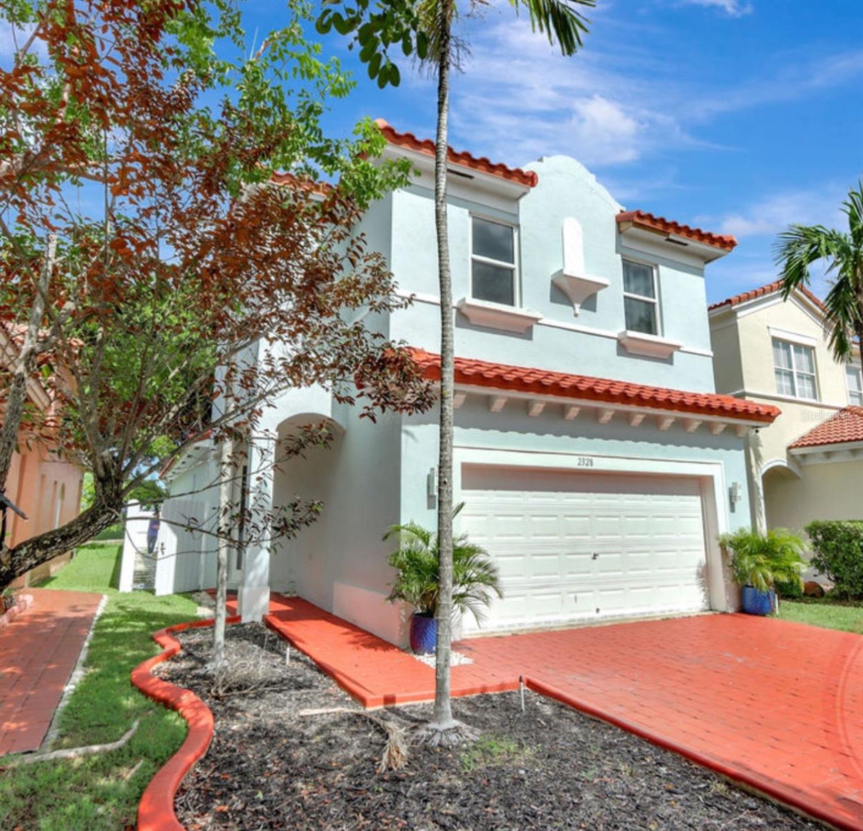 Welcome to 2328 NE 37th Terrace, this beautifully maintained home in the desirable Portofino Bay gated community of Homestead! Featuring a recently remodeled upstairs bathroom, newer roof, fully fence and complete with impact windows and doors, this residence offers peace of mind and modern comfort. This beautiful home presents with a functional and spacious layout for family gatherings, school projects/work or just relaxing.  All-tile flooring throughout for easy maintenance, a beautiful kitchen with granite countertops and plenty of cabinet space. The 2nd floor offers spacious bedrooms, an indoor laundry and 2 full sized bathrooms. Enjoy a tiled patio for easy maintenance with a tiled side walkway, a large driveway for ample parking, and a spacious 2car garage! The abundant natural light filling every room brings the beautiful a peaceful and relaxing atmosphere. Perfectly situated near great schools and central conveniences, this home is move-in ready and waiting for you!