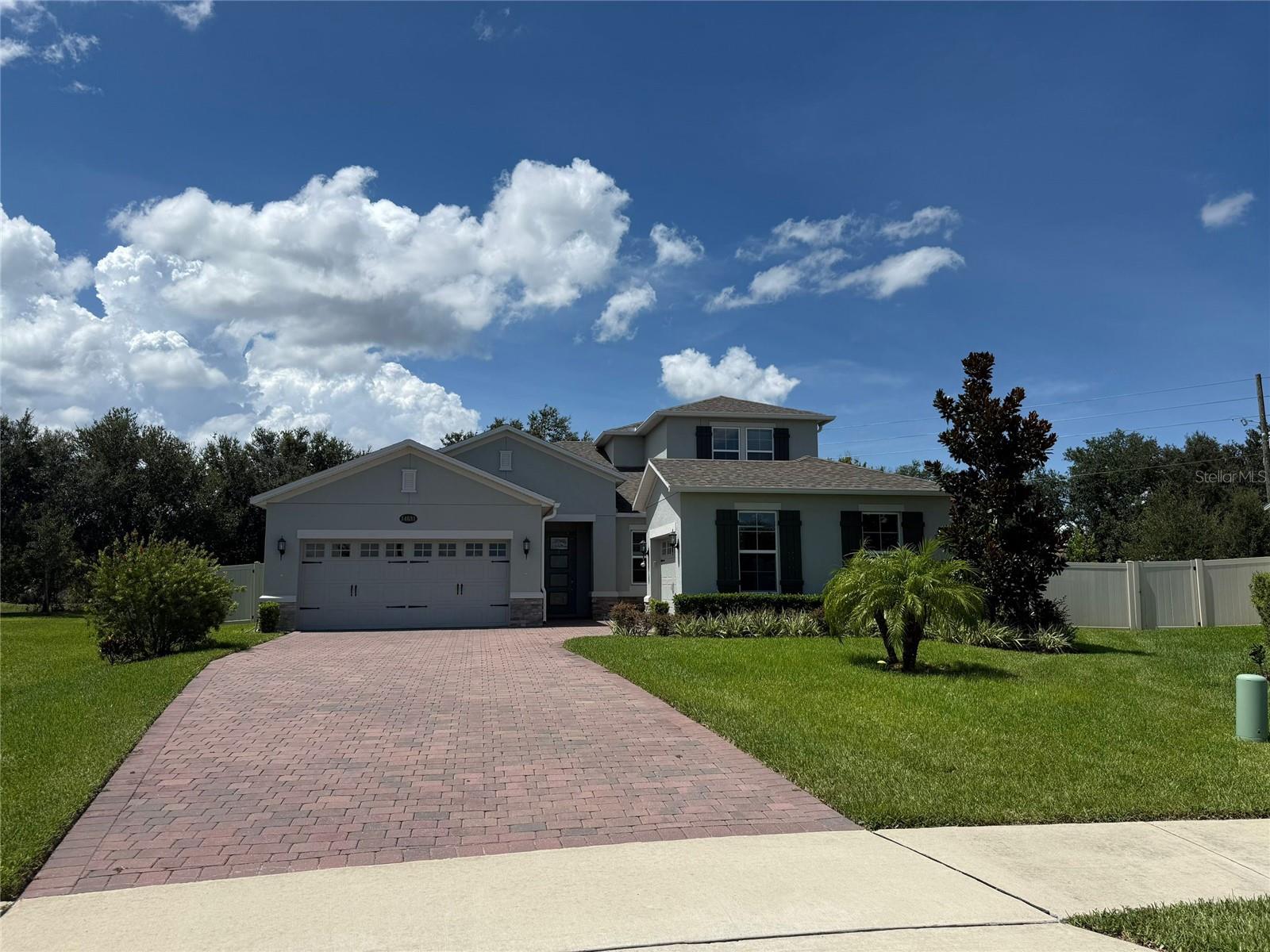 Gated community with a back yard fenced no neighbor in a big lot single house, upgrade decoration with granite countertop and tile floor throughout the first floor, one open room with bathroom upstairs, the rest of bedrooms and bathrooms downstairs.