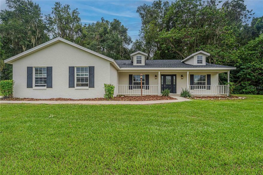 Location Location Location! This robustly equipped holding sits equidistant from the HITS show grounds and WEC expo center (13 and 14 miles respectively). Boasting an acreage just below 16, charm and functionality meet potential in the heart of central Florida's Horse Country. 

The flexibility of this turnkey farm features five lush irrigated paddocks situated on four legally subdivided parcels allowing for the development of a family compound or various build combinations immediately or down the line. The acreage at the front of the property is partially wooded providing picturesque privacy from the road, perfect for a new home build or development of a riding arena.

The well-appointed center aisle barn is designed for serious equestrian use. It includes eight matted stalls with electric, a wash rack and tack area, a half bath, and a large open hay storage loft with potential for the creation of living space.

The barn runs on its own electric and well, offers 220 power, and has plentiful surrounding drive space for easy loading and unloading / RV and trailer access.

The three bedroom, two bathroom home features a brand new roof (Aug 2025), two-car garage, a screened-in back patio, and a relaxing front porch with views of the entire property.

Inside the home, you'll find a warm and inviting kitchen with stainless steel appliances, breakfast bar, and separate dining area leading to the large living room. The master suite's large eastern and northern exposures provide beautiful natural light, and has walk-in closet space and a large en-suite bath. The home has a split floor plan and newly installed luxury vinyl plank flooring throughout.

With its prime location, and versatile layout, this property is a rare find in Reddick's thriving equestrian community. Schedule a private tour and discover this gem
