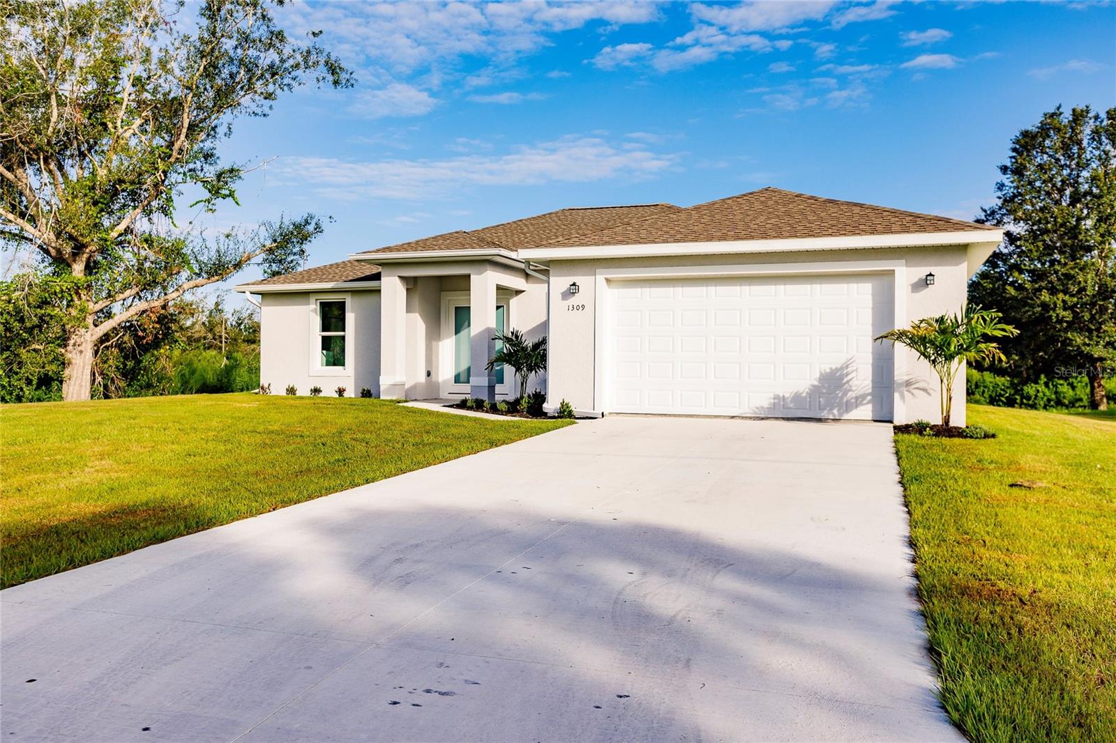 One or more photo(s) has been virtually staged. HUGE PRICE ADJUSTMENT on this Brand New 2023 Home! Was off market. Never lived in. BACK ON MARKET Welcome to your newly finished, modern oasis in the heart of North Port, Florida! This stunning split floor plan with 3 beds/2 full bath & spacious 2 car garage impresses. Step inside and be stunned by the sleek elegance of quartz countertops throughout the kitchen and island. Your separate Primary bedroom with beautiful, en-suite bath & huge master closet also boasts private sliders to the lanai! This is a true statement of modern living. The popular open concept home features luxury vinyl plank flooring throughout, providing both style and durability. Notice the thoughtful details throughout with tray ceilings, ceiling fans and modern lighting. The spacious lanai beckons you to relax and enjoy the serene surroundings of this quiet sought-after neighborhood. This home combines the latest in construction & code with timeless design. This home is perfect for both entertaining and daily living. Brand NEW 2023! Great opportunity to own in this very popular, fast-growing community in the U.S. Don't miss out! Make your appointment to see today!