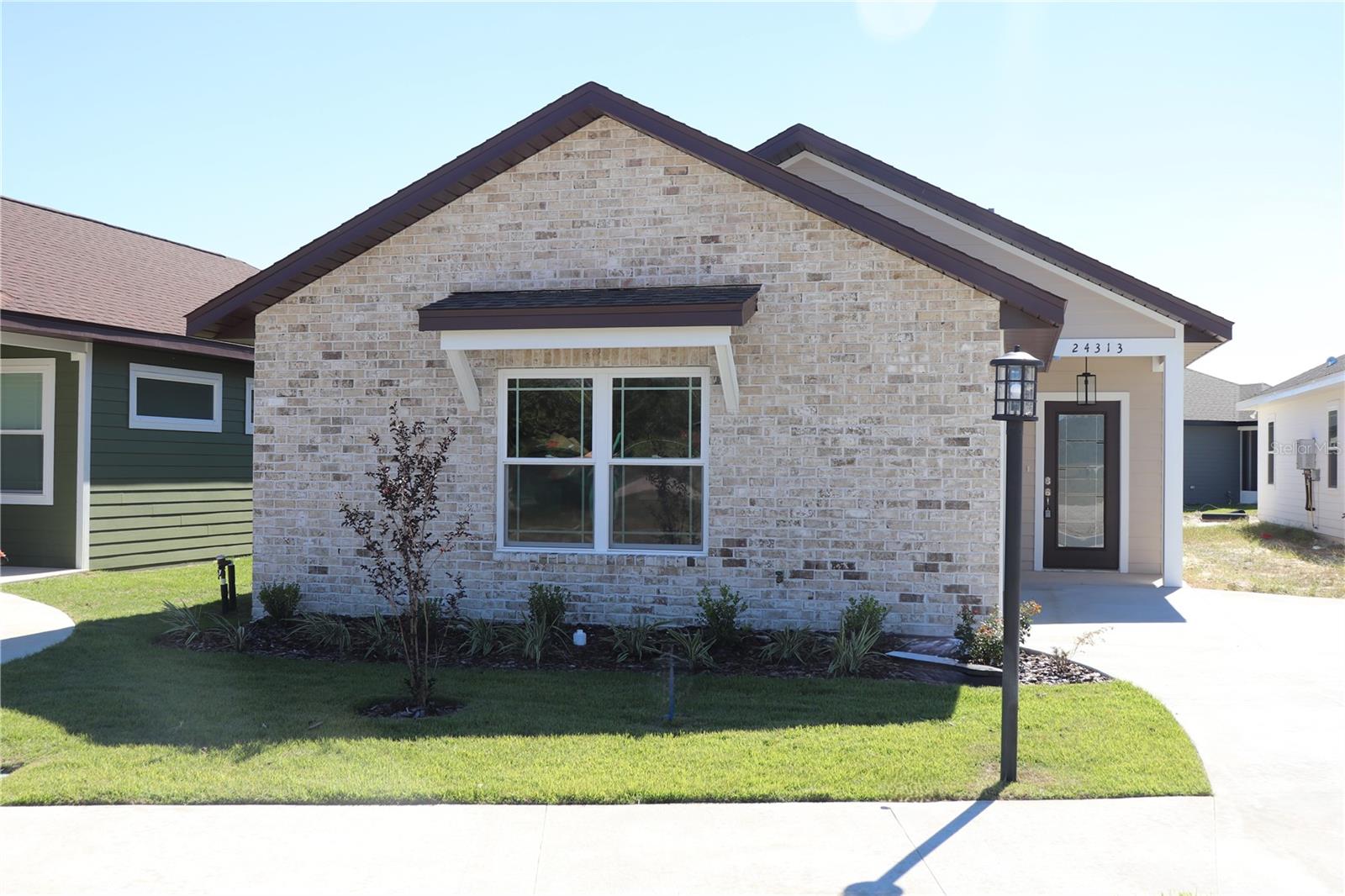 COUNTRYWAY TOWN SQUARE Enjoy the ambience of a small town yet close to all you need. Beautiful just completed 3/2 in sought after community with pool, volleyball, Stonehouse Grill, Tortillas TexMex, BIM health facility and regular live concerts. Enjoy the home and community built by one of the areas’ premier builders, NORFLEET HOMES. Beautiful Brick front. The open spacious floorplan maximizes space and lives larger than its footage. Refrigerator included. Upgraded engineered wood flooring, open floor plan (open kitchen, family and dining), 9’ ceilings, oversized 1 car garage, covered porch, fenced yard, sprinkler system in front and Newberry utilities. Propane Gas stove and tankless water heater. HOA takes care of front yard! Low Maintenance yard. HOA paid quarterly/$250. Great location with downtown Newberry, grocery, pharmacy, stores, premier sports facilities and restaurants within 2.5 miles. Preschool, elementary, middle and high school all within 1 mile. Enjoy the outdoors and relax at one of the many springs and state parks within15-20 miles. Very accessible (within a half mile) to main arteries State Roads 26, 235 and 41/27 to Gainesville, Alachua, High Springs & Archer. You will be PLEASANTLY SURPRISED at the cost of insurance for a new home and the affordable Newberry Utilities
NOTE: House was temporarily occupied short term.. Builder is treating as new build to buyer with full warranty