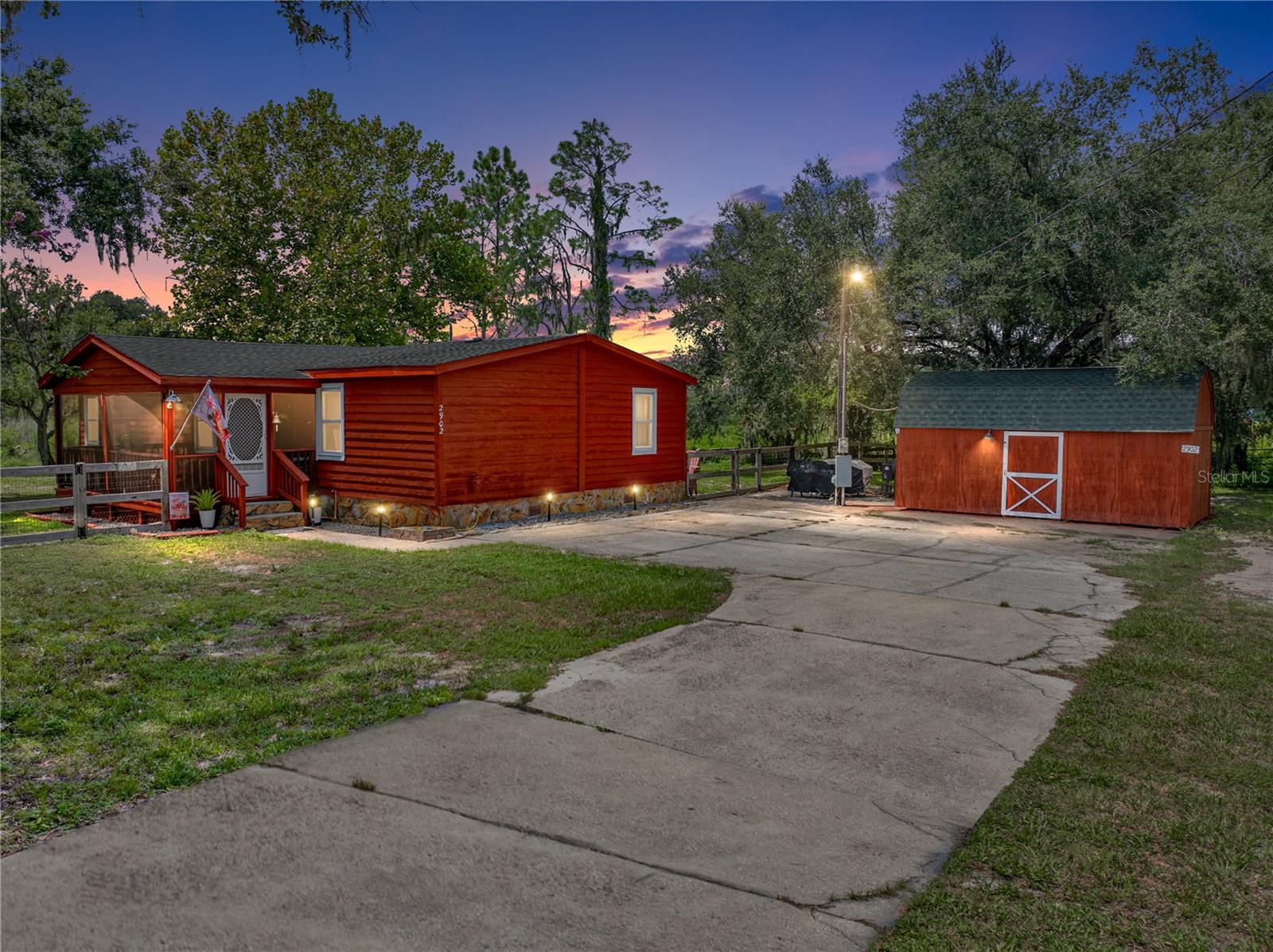 Discover the perfect blend of modern updates and peaceful country living on this 1.06-acre property featuring a beautifully updated 3-bedroom, 2-bathroom home. The split floor plan provides privacy for the primary suite, while the open living areas make entertaining and everyday living a breeze. Recent updates mean peace of mind for years to come — including new plumbing (2025), septic system update (2022), AC replacement (2024), new well pump (2022), and tankless hot water heater (2020). Both bathrooms received a stylish makeover in 2023, the exterior was freshly painted, the dishwasher was replaced in 2025, and the fence was updated in 2023. Two sheds—both with electric—offer the perfect spot for hobbies, storage, or a workshop. With a location that combines the tranquility of country living and the convenience of nearby amenities, this property is ready for its next chapter. All that’s left to do is unpack and enjoy your own slice of Florida paradise!