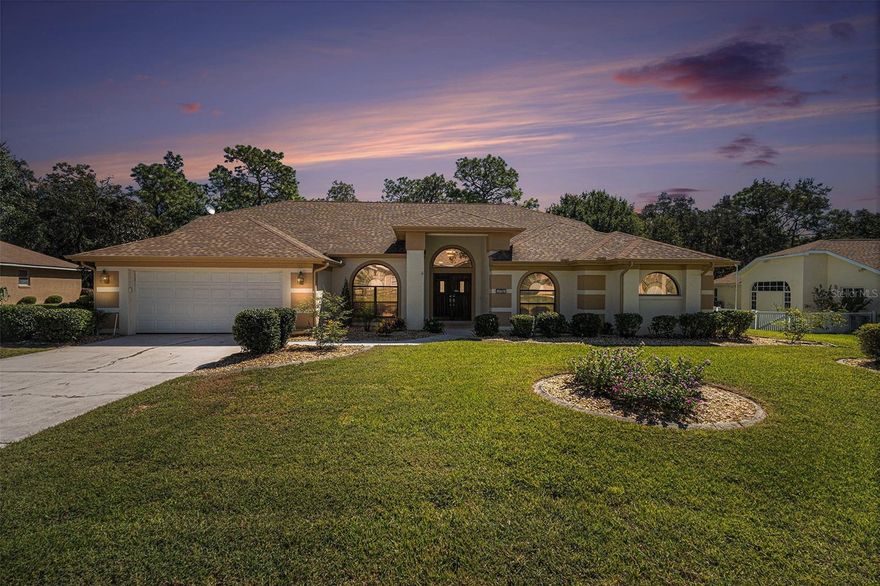 Welcome to this stunning 4-bedroom, 2-bathroom residence, perfectly situated on over a quarter
acre in the highly desirable community of Sugarmill Woods. This home offers the perfect blend 
of privacy, elegance, and modern comfort. 
Step through the double-door entry and be greeted by soaring 11–14’ ceilings, expansive 
sliding glass doors, and abundant natural light that creates a bright, airy ambiance throughout. 
The open-concept floor plan showcases **luxury flooring—no carpet anywhere—**combining 
style with easy maintenance. 
The spacious family room features a cozy fireplace and flows seamlessly into the updated 
kitchen and Florida Room, making this home ideal for both entertaining and everyday living. 
The chef’s kitchen is a true centerpiece, featuring granite countertops with seating, newer 
stainless steel appliances, smart-touch faucet, slide-out cabinetry drawers, and a built-in 
pantry. The formal living and dining rooms offer additional gathering spaces, adding 
versatility and elegance to the home’s layout. 
The primary suite is a luxurious retreat, complete with a tray ceiling, private access to the 
Florida Room, and a spa-inspired ensuite bath with a soaking tub, walk-in shower, dual 
vanities, makeup area, and a custom walk-in closet with built-ins. The fourth bedroom, 
connected to the primary bath, provides the flexibility to serve as a home office, nursery, guest 
suite, or even a dream dressing room. Two additional bedrooms are privately located on the 
opposite side of the home, sharing a beautifully updated full bath with a glass-enclosed 
tub/shower and direct backyard access—perfect for pool or patio days. 
A true highlight of this home is the expansive Florida Room—offering over 400 square feet of 
insulated, air-conditioned space with high-wind-rated floor-to-ceiling windows and luxury 
vinyl plank floors. Enjoy serene garden views year-round in this cool, comfortable 
indoor/outdoor retreat—perfect for entertaining or relaxing with your morning coffee. 
Additional features include a dedicated laundry room with custom cabinetry, stainless steel 
sink, and ample counter space; a fully fenced backyard with lush, fresh landscaping; a fully 
irrigated yard powered by a private well (no water bill!); and a two-car garage with built-in 
storage and natural light. 
With its thoughtful design, premium finishes, and major upgrades throughout, this remarkable 
home is truly turnkey and ready for its next owner to experience the best of Florida living in one 
of the area’s most sought-after communities.