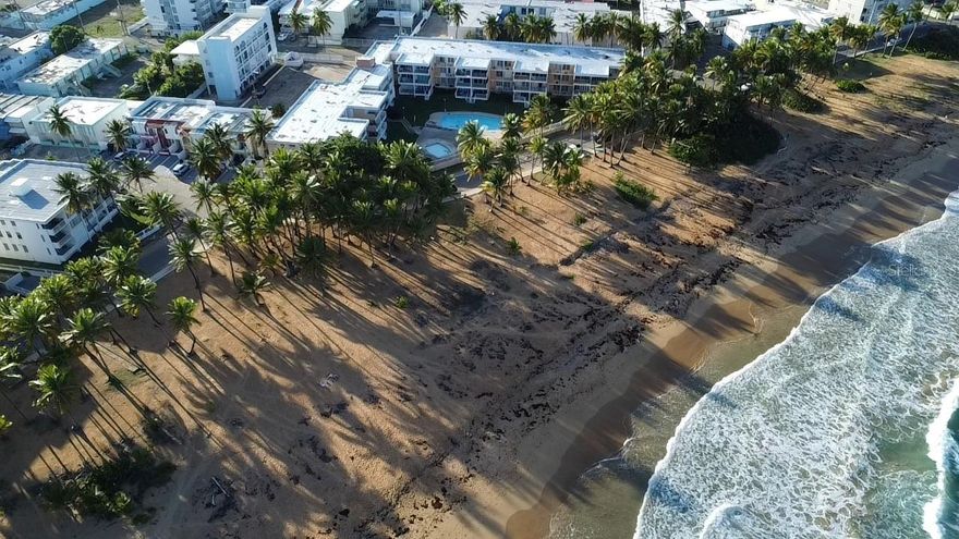 Costa Luquillo Condominium. Three-bedroom, two-bathroom apartment on the first floor with direct pool access. Located across from Blue Beach and minutes from Luquillo Kiosks, restaurants, supermarkets, and the best tourist areas in the eastern region. It also features one parking space, air conditioning in all bedrooms and the living room, aluminum and glass doors throughout, and comes furnished. The complex allows short-term rentals, making it a great investment.