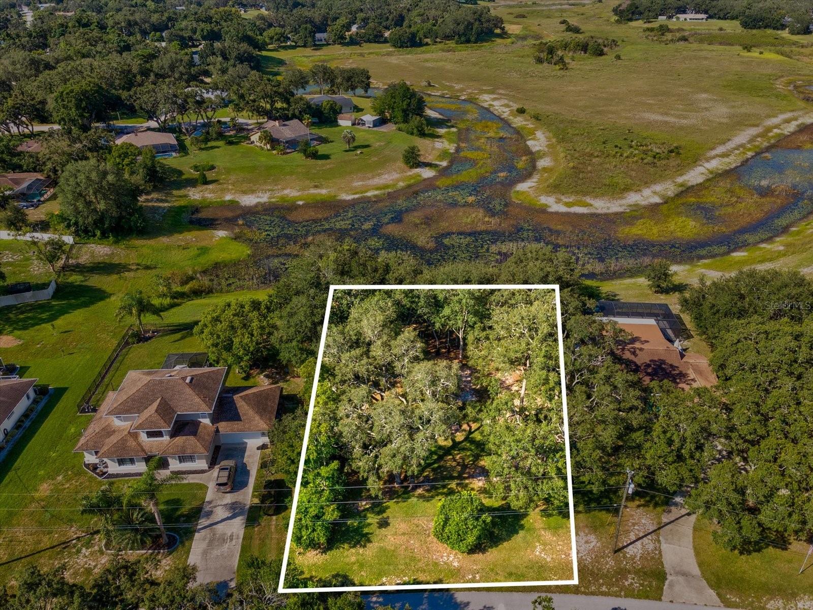 Build your dream Florida home on this beautiful Oak Lake View Lot! Enjoy peaceful surroundings and serene water views in a desirable location. For those seeking more space, the adjacent home to the right at 1063 Cambay Ln is also available for purchase—creating the rare opportunity to own a combined 1 acre of land. Don’t miss your chance to create the perfect Florida lifestyle on scenic Oak Lake.