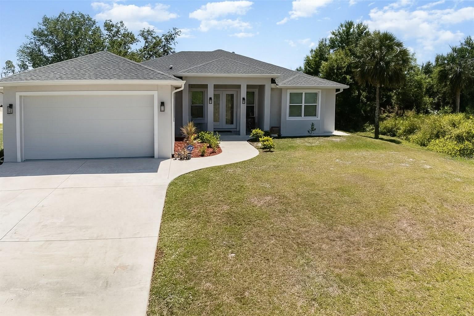 Don't miss out on this immaculate 2022 Custom Built Home!
This Elegant and Modern 3- bedroom, 2-bath home is designed with luxury upgrades throughout. Stylish and spacious, all set in a quiet North Port location. An open, airy floor plan features crown molding, modern lighting fixtures, a coffered ceiling, sleek modern lighting and durable luxury vinyl plank flooring.
The main living room featured coffered ceilings that rise to an impressive 12', creating a luxury look making the space feel both elegant and inviting.
The chef's kitchen is designed to impress with its luxurious quartz countertops, soft-close 42"shaker cabinets that extended an additional 18" for the extra stack storage cabinets, a sleek tiled backsplash ties the space together, complemented by under and above cabinet lighting that creates both functional and ambient illumination. The kitchen is equipped with upgraded Samsung appliances and features a spacious kitchen island, perfect for meal preparation and entertaining. The walk-in pantry included custom-built in shelving, offering even more storage and organization options.
The primary suite is a true retreat, offering a spa-like experience with a freestanding soaking tub and an oversized walk-in shower. The walk- in closet is thoughtfully designed with custom built-ins, providing ample storage and organization with a clean and polished look.
The two additional bedrooms are equally impressive, each featuring built in closets with custom built-in shelving and luxury Vinal flooring, ensures that every bedroom offers a sleek and organized feel.
EXTRA PROPERTY FEATURES! Impact proof glass windows, a whole- house water softener, Concrete sidewalk around the entire home for a clean curb appeal, Seamless gutters with buried downspouts, a separate laundry room with a sink, an extended two car garage and a screened in patio with epoxy flooring.
KEY PROPERTY BENEFITS! No HOA, Not Flood Zone! No deed restrictions! Close to the beaches, Lakes, Golfing, Shopping, Warm Mineral Springs and the North Port Aquatic Center.
All measurements are approximate and should be verified by buyer.
