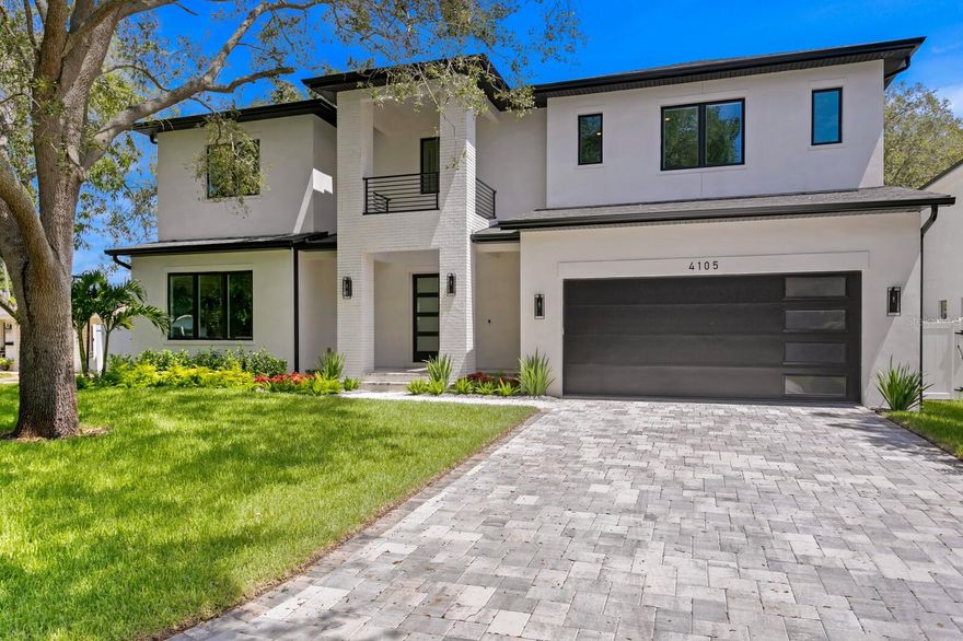 One or more photo(s) has been virtually staged. High and Dry, ready for its first owner! Welcome to this exquisite new construction home that in the heart of the highly sought after Palma Ceia West neighborhood in South Tampa, completed 6/1/24. This five bedroom five and a half bathroom custom transitional mostly block construction with impact rated windows and solid core doors by Berg Custom Homes. This home includes an additional office, playroom/exercise room, bonus room, oversized two car garage with electric car charger/additional space for storage. The home features additional insulation on the interior of the block and in the attic, quartz countertops throughout, built in shelving in all closets (closet renderings available upon request), engineered large plank hardwood floors (excluding wet areas), 7 1/4 in baseboards throughout, smooth finish drywall, gas hook up for a generator, and oversized covered front porch. On almost a quarter acre lot measuring 75x139 there is a heated saltwater pool with spa and sun shelf, still providing plenty of backyard to enjoy. The open floor plan is very versatile to suit many lifestyles, and includes one bedroom on the first floor providing an en suite with entry and exit of its own. Entering the home you will be greeted with a formal foyer leading into the massive kitchen and living combo. Office and exercise/playroom are on the first floor. The kitchen features a double island, Thermador appliances, custom shaker cabinets, built-in oven and microwave, gas cooktop, and huge hidden pantry. The living room/kitchen also includes a glass enclosed wine closet featuring racks as well as a wine chiller. The living area opens through large glass sliding doors to the covered lanai boasting an almost 400 sqft with built in outdoor kitchen and grill. On the second level you will find the primary bedroom with his and hers closets, coffee nook, walk in shower, and freestanding tub. The second level also includes an additional three bedrooms, large laundry room, and a bonus room. Call for your private preview today! 1/10 Builder Warranty!