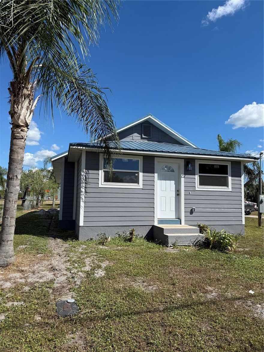 Come make this completely remodeled 3 /2  home your own!!  New roof, AC, kitchen cabinets, flooring, hot water heater.   You name it it's new. Great location!!!