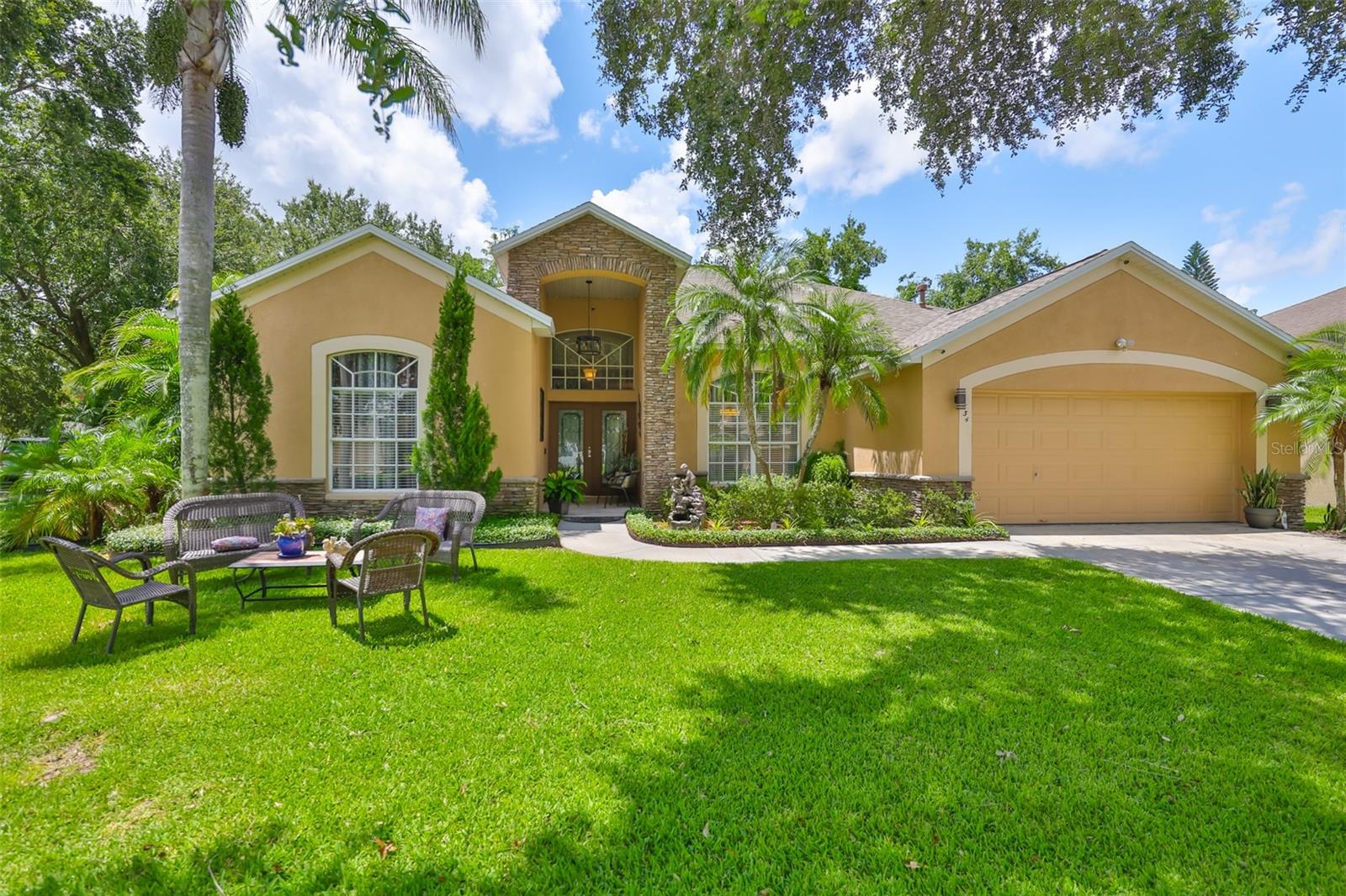 ATTENTION BUYERS! Welcome to this beautifully maintained 3-bedroom, 2-bathroom home located in the highly desirable Innergary Point community of Valrico, FL. Situated in an excellent school district, this home showcases true pride of ownership and thoughtful updates throughout. The heart of the home is a fully remodeled kitchen (2020), featuring elegant cabinetry, granite countertops, a striking tile backsplash, and stainless steel appliances, including a brand-new dishwasher installed just last month. The adjacent eat-in dining area overlooks the lush backyard and sparkling pool through a large picture window, filling the space with natural light. The primary suite is a true retreat, offering a spacious layout with a flexible bonus sitting area or office nook that opens to the covered patio and pool through sliding glass doors. The luxurious primary bathroom includes dual walk-in closets, dual vanities, a soaking tub, a walk-in shower, and a private water closet. The living room boasts beautiful tile flooring, abundant natural light, and seamless access to the screened-in pool and patio area—perfect for relaxing or entertaining year-round. Beyond the pool, you’ll find a fully paved backyard oasis with mature tropical landscaping, a pergola that stays with the home, and two storage sheds (both included). Additional features include a laundry room with built-in cabinetry, sink, and ironing board, a 2-car garage, and a well-shaded, manicured front yard with beautiful curb appeal. The A/C unit was replaced in 2016, and the yard is fully fenced for added privacy and peace of mind. The pool pump and the screen enclosure were both replaced in 2020. This exceptional home is move-in ready and perfectly located near shops, dining, and entertainment—offering a rare blend of elegance, function, and outdoor Florida living.
