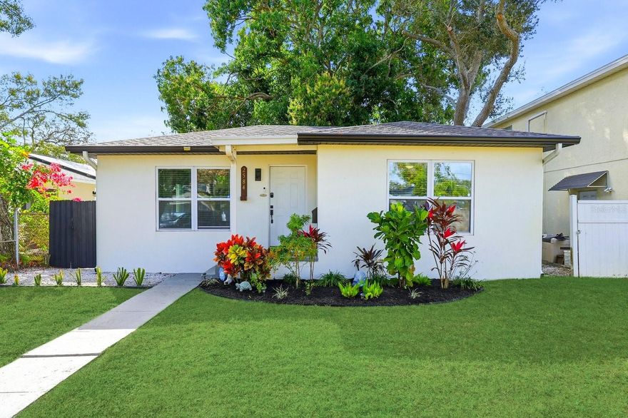 Welcome to effortless Florida living in the heart of sunny St. Petersburg. This impeccably renovated single-family home, updated in 2021, offers a perfect blend of modern comfort and prime location. As you step inside, you are greeted by an open and airy floor plan enhanced by the beauty and durability of luxury vinyl flooring that flows seamlessly throughout. The heart of the home is the stunning, updated kitchen, a true chef's delight featuring gleaming quartz countertops, stylish stainless steel appliances, and solid wood cabinetry with quiet-close drawers, offering both elegance and functionality. The home features two generously sized bedrooms and a beautifully appointed full bathroom, creating a private and peaceful retreat. A separate indoor laundry room adds a layer of everyday convenience that is often hard to find. Step outside to discover your own private oasis, a large, fully fenced yard providing a safe and spacious area for pets, play, or simply enjoying the beautiful Florida sunshine. Beyond the comforts of the home itself, the location is simply unbeatable. You are just one minute from quick access to I-275, making commuting a breeze. You are also minutes away from the vibrant energy of Central Avenue, with its eclectic mix of shops, restaurants, and breweries, and just a short distance to the excitement of Tropicana Field. For travelers, Tampa International Airport is a convenient 25-minute drive, and the world-famous, stunning Gulf beaches are a mere 10 minutes away. This is more than a house; it is a turnkey home in one of St. Petersburg's most sought-after locations.