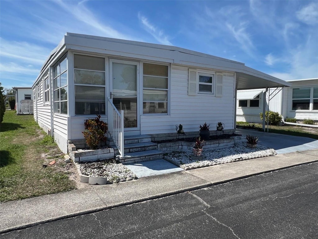 Photo of 37 Pindo Palm Street E, Largo, FL 33770 (MLS # TB8561905)