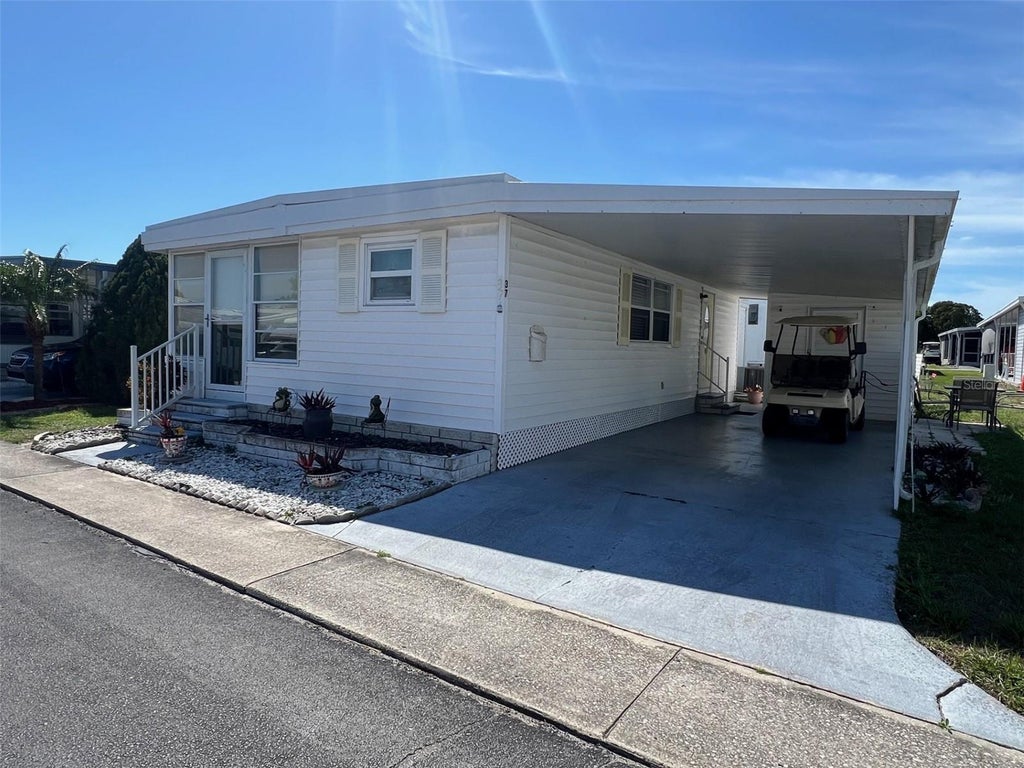 Photo of 37 Pindo Palm Street E, Largo, FL 33770 (MLS # TB8561905)