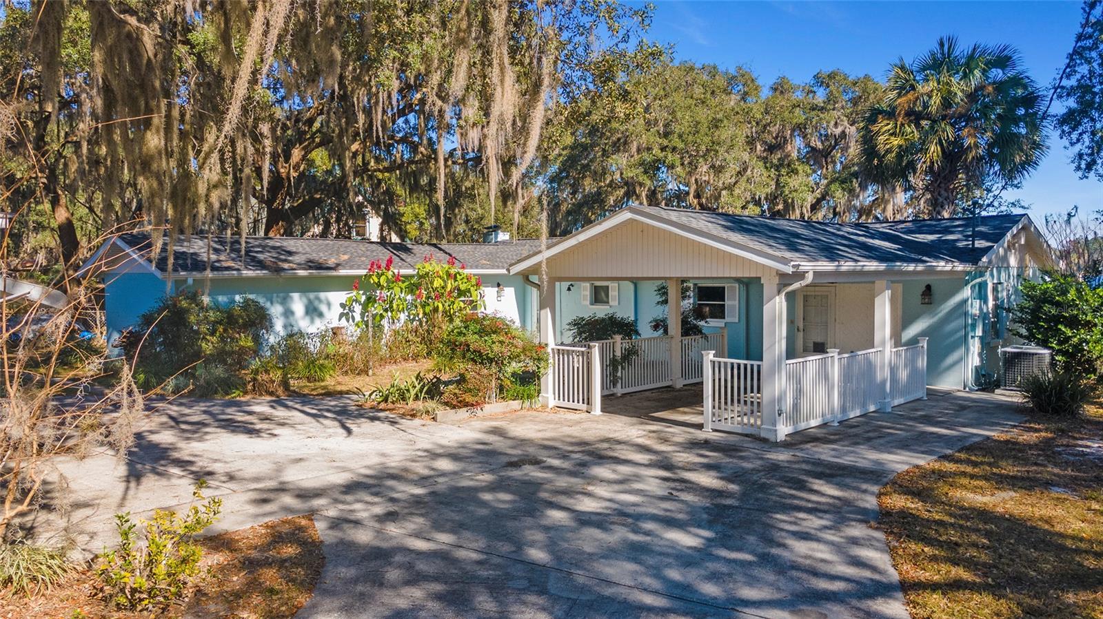 Spring fed, clear water Island Lake home features large windows w/picturesque views of the lake as well as gorgeous sunrises. This 3 bedroom, 2 bath home includes 2,296 square feet and was originally built in 1967. The lot is almost .5 acres (21,780 square feet) and has 100 feet of lake frontage. This property would be perfect as a primary residence or VRBO opportunity. The split open floor plan allows easy flow from living room, kitchen, and great room. The main bedroom is spacious with a large en suite bathroom. Two other bedrooms overlook the lake. Another flexible space could be a bunk room or office. The expansive laundry area has ample space for an extra refrigerator and freezer, or it could easily be transformed into another bathroom. The immense fenced yard includes a circular drive, attached carport/front porch seating area, 300 square foot storage building, 12’ x 16’ utility shed/workshop and a covered cabana that overlooks the lake. Recent improvements include a new roof, interior and exterior painting, new refrigerator and two new hot water heaters. This unique setting is close to Ft. McCoy, Orange Springs, Citra, Silver Springs, and Ocala. You or your renters could enjoy fishing, watersports (boating, skiing, tubing, wake surfing, etc.), canoeing, kayaking, paddle boarding, and hiking here and nearby.