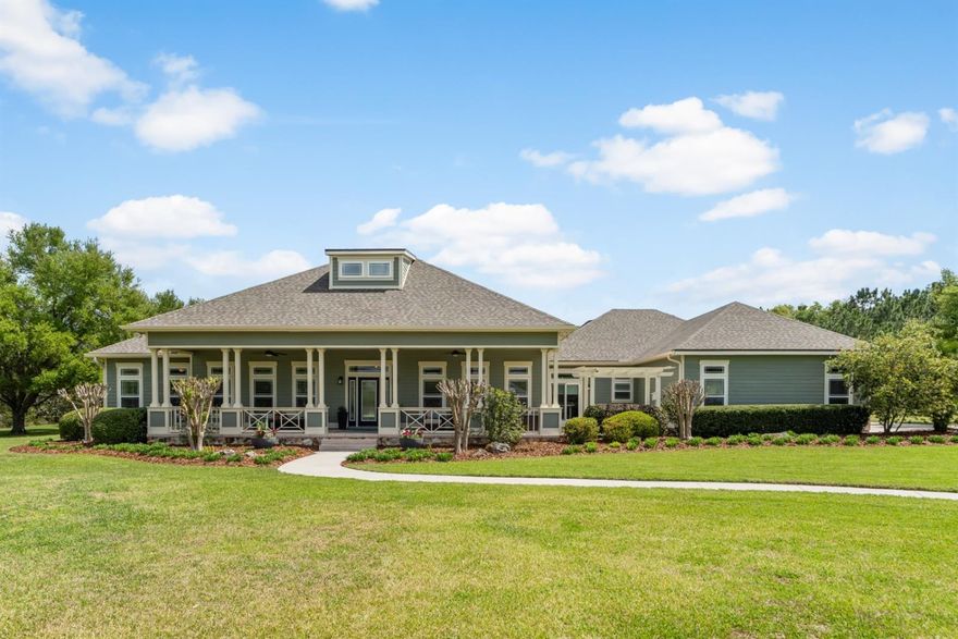 Welcome to this breathtaking craftsman-style estate, gracefully set on 2.71 acres of scenic meadowland within the prestigious gated community of Dylan’s Grove. Thoughtfully crafted by Royale Custom Homes and named “The Kensington,” this residence showcases an exceptional open-concept design filled with natural light and expansive windows. From the moment you enter, you’re immediately captivated by the soaring 20-foot ceiling at the foyer. Then as you walk towards the main living area your eye is drawn to the beautiful gas-powered fireplace and the 13-foot ceilings. Your gaze is then drawn to the sweeping views of the outdoor living space as seen through the stunning wall sized multi sliding glass doors that open completely to reveal a resort-style pool area complete with a gas firepit, tranquil waterfall, and a remote-controlled swim machine. The spacious, covered back patio features a remote-controlled retractable screen, creating the perfect setting for entertaining or relaxed everyday living. This home beautifully blends the seamless connection from indoor comfort to outdoor luxury. Offering 3,712 square feet of conditioned living space, the home includes 4 bedrooms, 4 bathrooms, a dedicated home gym, and a versatile study or office with private exterior access. The office overlooks a serene zen garden with a water fountain and gazebo, providing a peaceful retreat. The gourmet kitchen is ideal for both entertaining and quiet evenings at home, featuring unique granite countertops and upgraded appliances. Rich wood flooring runs throughout the residence, adding warmth and elegance. Additional highlights include a three-bay, side-entry carriage garage. Equipped with a whole house generator, recent updates provide peace of mind, including a new roof (2025), fresh interior and exterior paint (2026), a new hot water heater (2024), and a new AC system installed in 2018. For even greater peace of mind, you can rest assured knowing that the perimeter of the home is monitored by security cameras. Residents of Dylan’s Grove enjoy a variety of community amenities, including a pool with lap lanes, outdoor firepit, open-air lodge with fireplace, scenic decking, and paved walking trails. Conveniently located just minutes from both the Jonesville and the Newberry Publix, and a short drive to the bustling Tioga Town Center with its shopping, fine car shows, cultural events, Northwest Seafood, Dave’s New York Deli, Patticakes coffee & desserts, Tinker Latin Restaurant, Local Provisions Restaurant, Blue Highway Pizza, The West End Tavern, Fluid Lounge, Northwest Seafood, Volcanic Sushi, Cilantro Tacos and the world class ranked Gainesville Health & Fitness Center. Or for even more variety, take a ten minute drive to the City of Newberry that features an Olympic quality indoor/outdoor archery center, a spacious equestrian center that holds events throughout the year, or visit the Country Way Square with its restaurants and its annual action packed rodeo that draws professional cowboys from all over the United States to compete. Experience the perfect balance of privacy, luxury, beauty, and active living in this truly one-of-a-kind property.