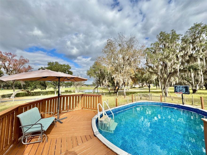 Looking for room to roam and a place to relax away from the noise? This 5 bedroom/3 bath 2,820sf country pool home on over 1/2 acre with private in-law suite delivers the best of both worlds! You'll be swept away by wide-open views, fresh air, and true quiet, yet you're just minutes from everyday conveniences. Inside, the eat-in kitchen is ideal for gatherings, featuring double ovens, a cooktop, and abundant counter and cabinet space. The living room opens to a screened porch overlooking the pool and peaceful lake. A spacious 400-sq-ft in-law suite offers its own screened front porch and adjacent full bath. The primary suite includes an en-suite bath, walk-in closet, plus two additional closets. Bonus spaces include a 15x19 craft room, 11x9 office, and walk-in pantry. Outside, enjoy a fully fenced yard surrounded by green space, small lakes, and open skies. Updates include Roof 2025, AC 2022, pool liner 2025, electrical panel 2026, water softener 2026, vinyl fence 2025. RV hookups (30 & 50 AMP) and two powered sheds add flexibility. Country charm within Inverness city limits. CLEAN 4-POINT INSPECTION. CALL TODAY, THIS IS THE ONE!