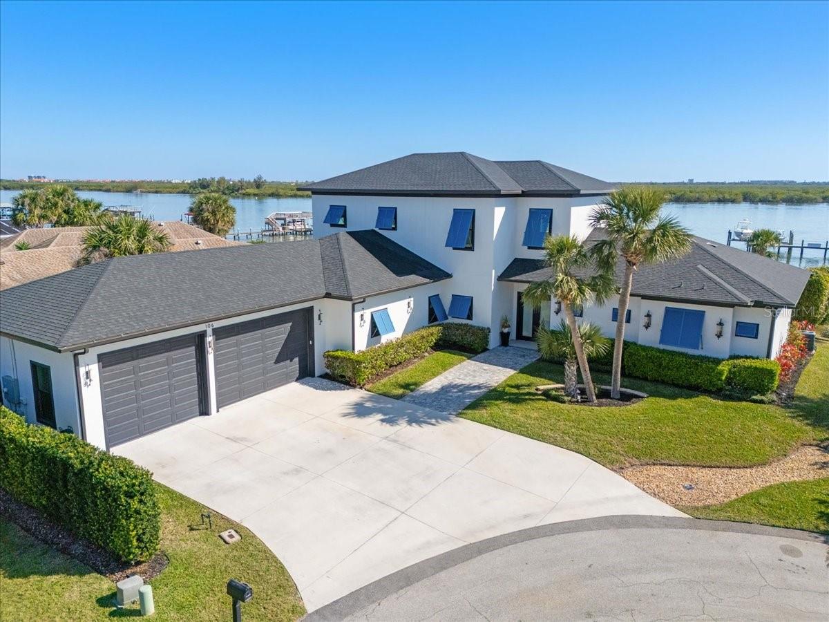Welcome to this incredible 2021 custom built Intracoastal home. This amazing 4,073 sqft, four bedroom, three and one half bathroom estate is located directly on the New Smyrna Beach Intracoastal Waterway. Upon entering the home, you will be greeted by soaring vaulted ceilings showcasing the water and an open floor plan. The home was designed around entertainment and accessibility. The dining room, kitchen, living room, primary bedroom and two guest bedrooms are all conveniently located on the main level of the home. The large chefs kitchen has an expansive island and state of the art appliances. Sliding retractable glass doors lead to a resort-style heated pool with an oversized sun deck. An additional 17x20 private screened lanai will be a relaxing retreat with a brand new HotSpring 7 seat hot tub. The second level of the home boasts a large room that can easily be used as a second primary or game room. A large upstairs balcony gives panoramic views of the dock, water and surrounding islands of the Intracoastal. The home also features a secured dock with a newer 10,000 lb lift, backyard green space, hurricane shutters, a 12 ft garage ceiling for boats and beautiful landscaping. Located within minutes of Canal Street, New Smyrna Beach Yacht Club, Flagler Ave. and the beaches! This is an amazing opportunity to live in one of Florida's most desirable intercoastal communities. This exceptional property provides an unparalleled opportunity to own a piece of paradise.