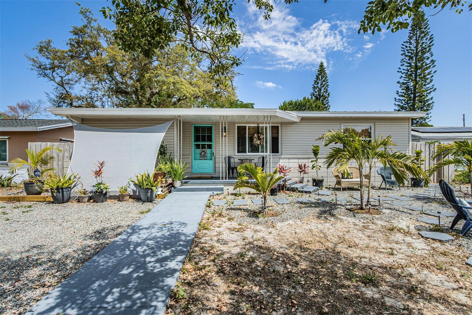 Welcome to this charming three-bedroom bungalow in West Gulfport. Nestled on a beautiful brick-lined street, this home exudes warmth and coziness while still providing ample space for you to spread out and enjoy. As you step inside, you'll appreciate the split bedroom floorplan which allows for privacy and separation between the largest third bedroom and the other two bedrooms. The quaint eat-in kitchen is perfect for cozy meals, while the separate living and dining rooms provide plenty of space for entertaining. One of the bedrooms has its own entrance, making it a flexible space that can be used as a private bedroom, home office, workout room, or art studio. Hardwood floors add to the home's charm, while the inside laundry closet and natural gas water heater add convenience. Step outside and you'll find a small front porch that's cute as a button, perfect for enjoying your morning coffee or evening cocktails. The extra-large private backyard is fully fenced and features a large covered lanai, providing the perfect space for outdoor entertaining. There is alley access with a double-wide gate and electric for your recreational vehicle, making it easy to come and go as you please. You'll appreciate the new 2021 standing seam metal roof, which will provide peace of mind for years to come. Plus, this Gulfport location is in a non-flood zone, so no flood insurance is required. You'll be conveniently located near all downtown Gulfport has to offer, including the marina and boat ramp, restaurants, coffee shops, beach, shopping, fishing pier, weekly farmers market, annual festivals, nightlife, and more! Furthermore, this home is only 10 minutes from the award-winning St. Pete Beach (Trip Advisor's #1 Beach for 2021), 10 minutes to vibrant downtown St. Petersburg and Tropicana Field, and 10 minutes from the Tyrone Shopping District. In addition to its fantastic location, this bungalow is also situated just blocks from Stetson University's College of Law. This makes it an ideal home for anyone who wants to be close to the action of one of the most popular law schools in the region. All room measurements are approximate and should be verified by the Buyer.