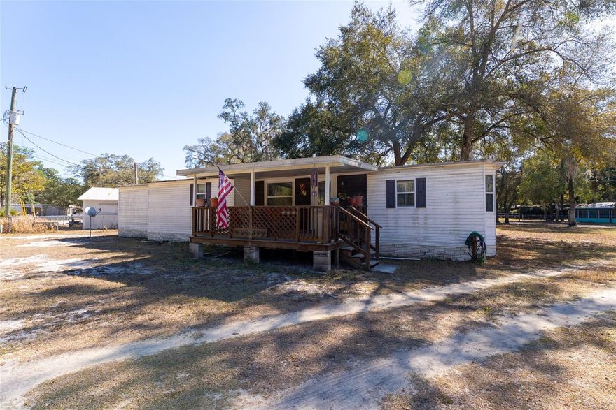 Welcome to your slice of Old Florida paradise in beautiful Salt Springs! 
Surrounded by nature,  Located in Ocala National Forest. This2-bedroom, 2-bath mobile home offers the peaceful lifestyle you’ve been dreaming of. Whether you love boating, fishing, hunting, or quiet nature walks, this location has it all!
Enjoy access to a sparkling spring-fed lake—Lake Kerr—where, for a small yearly fee, you can take advantage of the community boat ramp, swimming area, and even a building available for gatherings and special events Nestled among majestic oak trees! Spend your weekends exploring, nearby Salt Springs Marina, where you can launch out onto Lake George, the second-largest lake in Florida, for unforgettable days on the water.
The property itself runs road-to-road, giving you added flexibility and lots of room for storing your toys!Just 23 miles from Palatka, you’re close enough to town while enjoying the serenity of country living and tucked away feel!
And let’s talk about the double-sided workshop with separate entrances — oh the possibilities! A creative space, hobby room, storage for your outdoor toys, maybe even that little dream business you’ve been thinking about. Let your imagination roam.
If you’ve been searching for natural beauty, lake life, and room to dream, this Salt Springs gem is ready to welcome you home.
