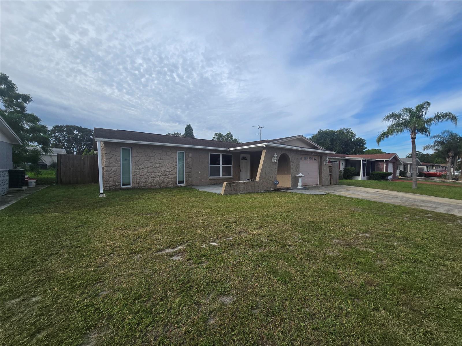BETTER GET HERE QUICK. PERFECT STARTER HOME, 2/2/1 CAR ATTACHED GARAGE, WIDE OPEN LAYOUT, FENCED YARD, ABOVE GROUND POOL IS IN GREAT SHAPE. LARGE YARD, BEAUTIFUL TILE FLOORING, KITCHEN IS OPEN TO DINING AND LIVING ROOM COMBINATION. COVERED LANAI IS PERFECT FOR ENTERTAINING. THIS HOME WOULD BE A GREAT INVESTMENT HOME FOR A RENTAL, OR A PERFECT STARTER HOME. BETTER BE QUICK.