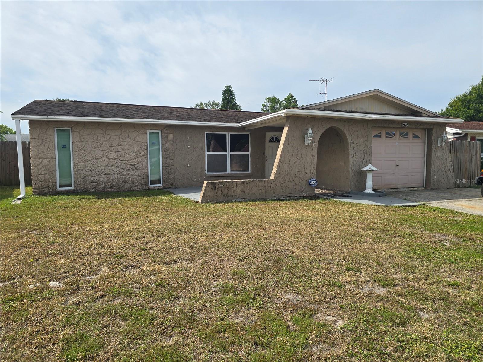 BETTER GET HERE QUICK. PERFECT STARTER HOME, 2/2/1 CAR ATTACHED GARAGE, WIDE OPEN LAYOUT, FENCED YARD, ABOVE GROUND POOL IS IN GREAT SHAPE. LARGE YARD, BEAUTIFUL TILE FLOORING, KITCHEN IS OPEN TO DINING AND LIVING ROOM COMBINATION. COVERED LANAI IS PERFECT FOR ENTERTAINING. THIS HOME WOULD BE A GREAT INVESTMENT HOME FOR A RENTAL, OR A PERFECT STARTER HOME. BETTER BE QUICK.