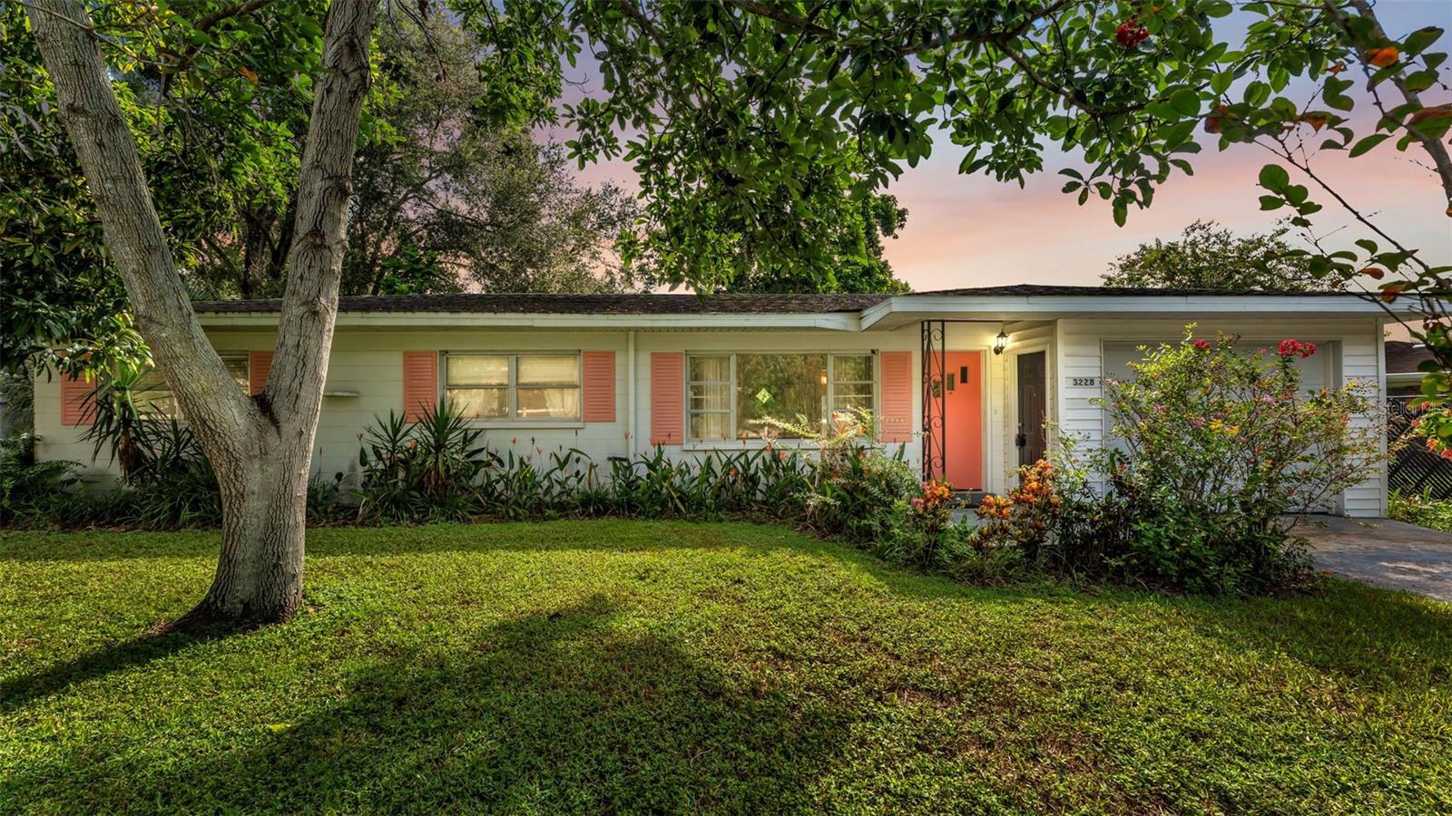 If you have been searching for a home in the established and centrally located area of Lakeland your search is over! This home offers so much character & charm! No HOA! You will fall in love with all the mature landscaping along with your very own delicious producing avocado & mango trees! In your home you will find you have 2 separate living areas offering a lot of options of room uses. The back family room is incorporated with a lot of natural light throughout with all the windows offering the amazing view of your maturely landscaped back yard. You have a screened-in back patio with a pass-through window to the kitchen as well as open paved patio space along with a quaint firepit area. Your kitchen has a large pantry cabinet incorporated with pull out shelves. Kitchen offers eat-in dinette space and the moveable island currently in the kitchen will convey with the home. Coved ceilings in the front living room and a view of the beautiful front yard via the windows providing a lot of natural light in this room too. You have decorative light fixtures in the home. The hall bathroom offers a large vanity and a tub/shower combo. You have a deep garage with electric opener as well as access doors to/from the garage from the side yard and the covered front door entry area. Your back yard is fully fenced offering privacy and is ready for your fur babies. Electrical panel has had upgrades. Approx age of other big-ticket items are: High End Hot Water Heater 2017. Home was re-plumbed in 2025. A/C 2021. Roof 2013 (back of home roof replaced approx. 2 years old). Newer dishwasher. This is a must-see home if you are search for a home with character, centrally located, NO HOA, location location location!……You are within a mile to shopping, clinics, restaurants and the 570 Toll Rd taking you to Tampa/Orlando. Don’t delay and miss the opportunity to call this home yours!
BE SURE TO CLICK ON THE VIRTUAL TOUR LINK.