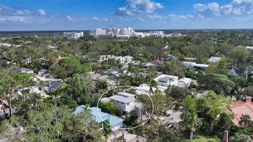 Custom built for the current owner in 2019 by sought-after builder Jonas Yoder, this home was thoughtfully designed with beautiful detail throughout. Located in the heart of the prime West of Trail Hudson Bayou neighborhood, this 2,215 square-foot contemporary home offers 3 bedrooms with ensuite bathrooms, a private office, and a powder room. The open-concept living space features 10-foot ceilings, a skylight, and oversized impact windows, allowing abundant natural light. The kitchen showcases designer appliances, an induction stove and an large quartzite island with counter seating and solid wood cabinets. The spacious primary suite is located on the main level and includes a spa-like bathroom with freestanding soaking tub, as well as indoor and outdoor showers. The office and additional bedrooms are located on the second level, along with a private balcony off one of the bedrooms. Other notable features include custom-built closets, a sound system, and an air-conditioned shed. Additionally, the home is pre-wired for a whole-house generator. Off the main living area, a wall of sliding doors opens to a panoramic screened lanai that overlooks the heated saltwater pool and a lush, tropical landscaped yard. The large outdoor patio and mature landscaping provide privacy, perfect for enjoying Sarasota's outdoor lifestyle. Ideally situated, the property is just a short walk to the shops and restaurants of Southside Village, Marie Selby Gardens, and the downtown Sarasota Bayfront. It is also a short drive to the world-famous beaches of Lido and Siesta Keys, offering the best of everything Sarasota has to offer.