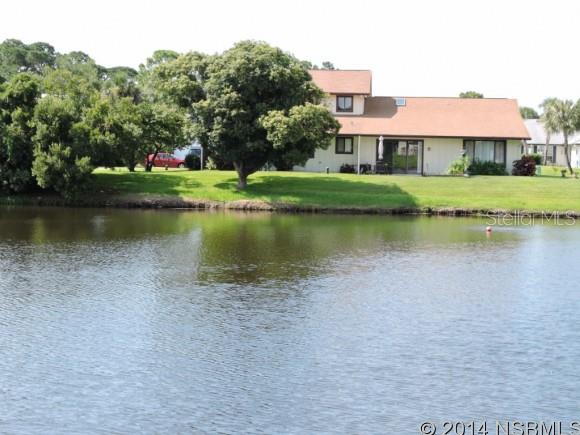 Spacious 3 bedroom waterfront home with formal dining room, eat-in kitchen and 2 screen porches to enjoy the cool breezes. The large, waterfront screened porch is bound to become your favorite place to relax and even entertain, enjoying the water fowl, egrets along the shore line, turtles and the occasional otter. Architectural shingle roof new in 2000, microwave 2014 and new A/C system December 2013. Large entry screened porch gives you second outside living space. Formal dining room adjacent to spacious living area. Lots of storage, including walk-in closet in master suite and large storage closet in hallway. Home is nicely updated with freshly painted interior and Brand New Kitchen Counters and Counter Tops. Brand new Guest Bath Cabinets. Centrally located in popular Fairgreen Golf Community - nestled between 2 golf courses, plus heated community pool by optional membership. Low HOA dues of $750 annually include Cable TV, treat & repair termite bond, common area maintenance and complete maintenance and operation of sprinkler system for your home, including water to it. Close to everything, minutes from beach, shopping and dining. ;Water: City
