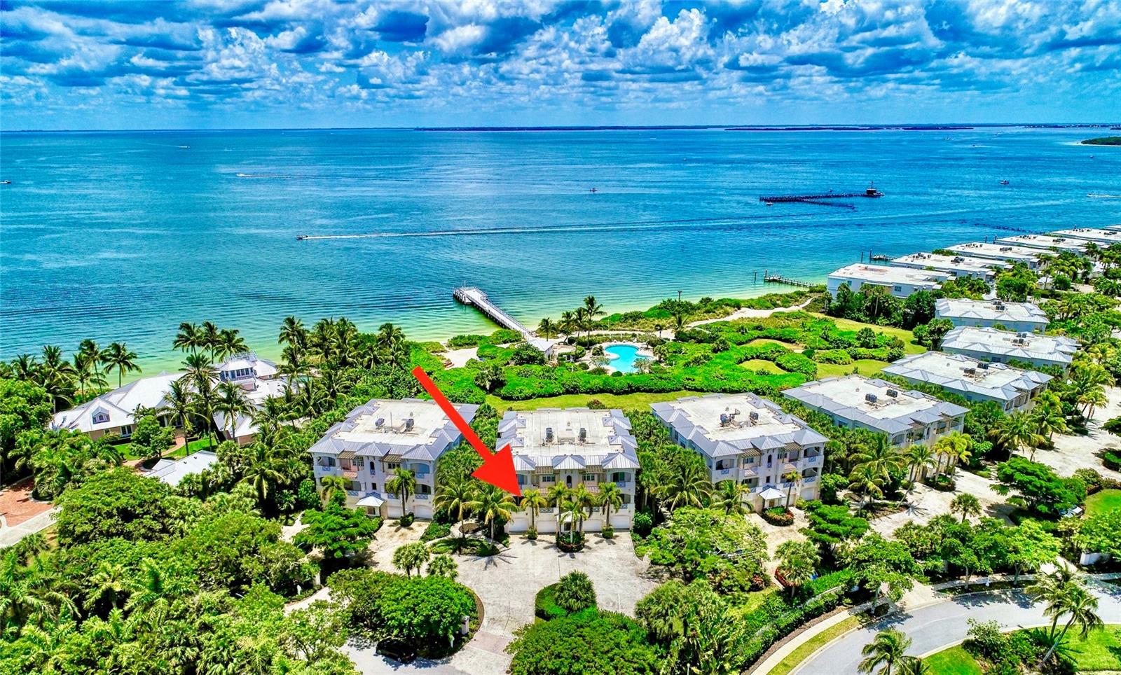 Indulge in a captivating symphony of nature's wonders right from the comfort of your own lanai. This splendid 3-bedroom, 2-bathroom 'Harborside' condominium within Boca Bay presents an idyllic sanctuary immersed in the breathtaking landscape of Boca Grande. Step inside to an interior that effortlessly blends elegance and charm. Boasting generous ceiling heights, custom millwork, and the timeless touch of old-fashioned glass transoms above interior doors. Plantation shutters adorn the windows, complementing the Impact Glass windows and doors throughout the residence. Designed for ease and comfort, revel in the convenience of single-level living, complemented by the inclusion of a private garage, a separate storage room, and effortless elevator access—offering the epitome of a 'lock the door and walk away' bayside retreat. Venture outside to discover a world of recreation at your fingertips. Immerse yourself in the sparkling swimming pool, one of four, or unwind on the bayside beach just steps away. The community fishing pier invites you to engage in the joy of angling right in your backyard. For culinary delights and socializing, the private gulf-side Boca Bay Pass Club awaits, offering casual dining in a world-class setting. Enhance your active lifestyle with access to seven Har-Tru tennis courts and a fully equipped fitness center, all just minutes from your door.