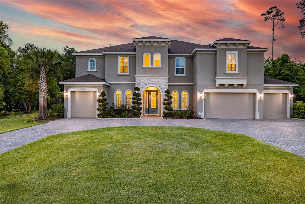 LUTZ LAKEFRONT OASIS! This beautiful lakefront home sits on one of the largest lots in Lake Hanna Preserve with more than 3 acres and amazing lake views of Lake Hanna (a ski lake) from the luxurious pool and outdoor living space (ready for an outdoor kitchen). Two primary bedrooms one on each floor with 7 bedrooms and 5 full bathrooms! Bright, airy and open, this 2019 home was built with foam insulation that keeps it extremely well insulated and greatly reduces electricity use. A gourmet kitchen, full of upgrades, with expansive island opens to the great room and double sliders connecting to the pool deck and spacious backyard. Butler's pantry connects the kitchen to the dining room and includes a walk-in pantry. Upstairs the 2nd primary suite opens up to a large bonus/game room and separate media/theater room. Privacy abounds with only one neighbor to the right separated by a grove of dense trees. Room Feature: Linen Closet In Bath (Primary Bathroom).