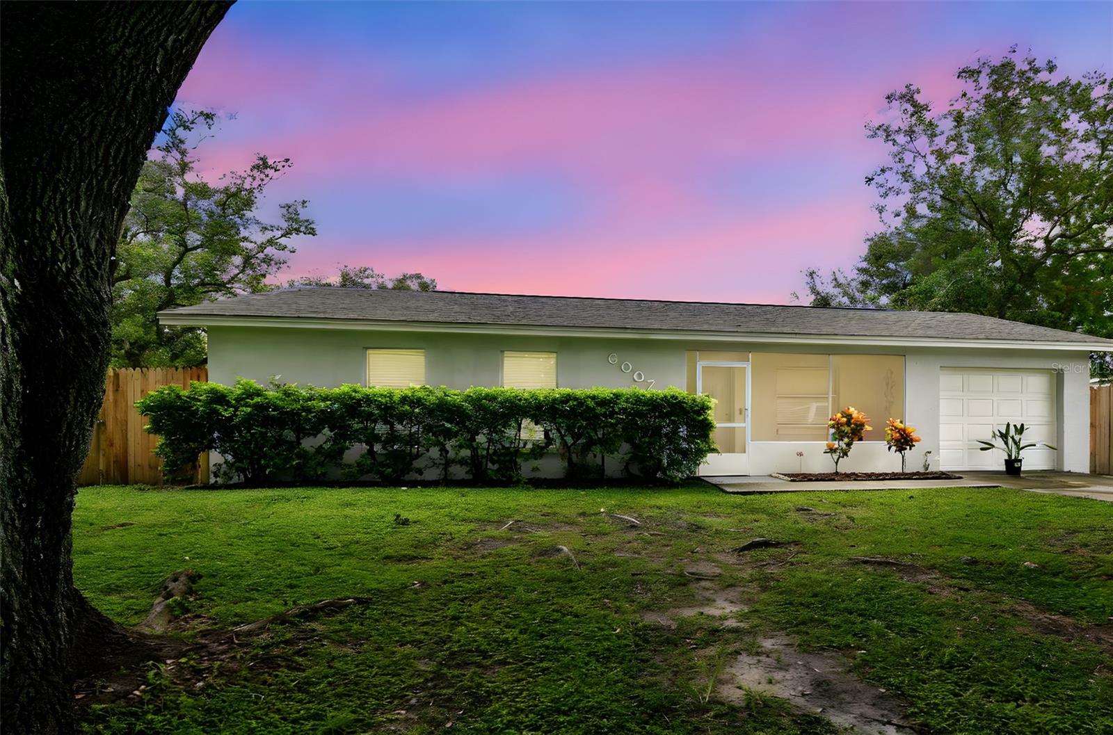 Welcome to 6007 Calendar Ct W, a beautifully updated 3-bedroom, 1.5 bath home + mother in law suite with a private 1 bedroom 1 bathroom nestled on a quiet cul-de-sac in Lakeland. Step inside to find light-filled living spaces with modern tile flooring, fresh neutral paint, and recessed lighting that create an inviting atmosphere. The kitchen features granite countertops, upgraded cabinetry, and a full suite of appliances, blending style with functionality. Bedrooms are generously sized with ample closet space, while the renovated bathroom showcases a sleek vanity, contemporary fixtures, and elegant finishes. Outside, enjoy a screened-in front porch perfect for morning coffee, plus a spacious backyard with no rear neighbors—ideal for entertaining, gardening, or future expansion. With a one-car garage, new upgrades, and a prime location near shopping, dining, schools, and major highways, this home offers both comfort and convenience in one of Lakeland’s most accessible neighborhoods. The garage has been converted into the mother-in-law suite.