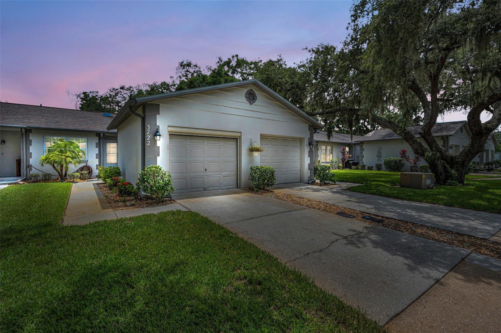 Completely updated 2BR/2BA villa with 1-car garage in prime location! This move-in-ready home features a split bedroom floorpan, wood-look tile flooring, vaulted ceilings, and plantation shutters throughout. The stylish kitchen offers stainless steel appliances, a wine refrigerator, beautiful backsplash, and a breakfast bar perfect for casual dining. Additional highlights include barn-style closet doors, a utility room with built-in cabinetry, and updated baths. Roof replaced in 2018. Enjoy outdoor living on the private back patio. Conveniently located near shopping, dining, and top hospitals. Low-maintenance living with upscale finishes! Basic cable, internet, trash, lawn care & community pool are included in the HOA fees.