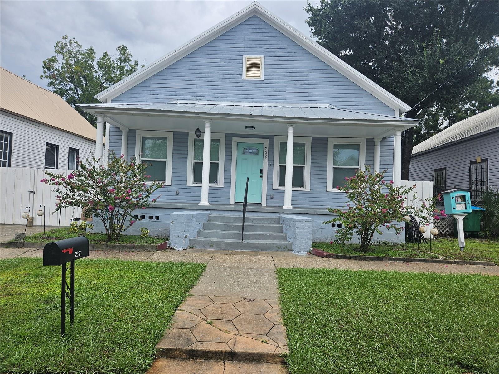 Welcome to your charming 2-bed/2-bath bungalow in the heart of West Tampa, just off Howard/Armenia Avenue. This cozy, yet spacious home features soaring high ceilings that create an airy and open atmosphere, making each room feel even more expansive. The living area is perfect for relaxing or entertaining, with plenty of natural light streaming in through multiple windows. The WELL-APPOINTED KITCHEN offers modern amenities and ample counter space, ideal for cooking for friends & family. Both bedrooms are generously sized, with the primary suite offering a large private EN0SUITE BATH for added convenience. The second bath is easily accessible from the main living areas and the second bedroom, making it perfect for guests. Out front, you'll find a CLASSIC FRONT PORCH where you can enjoy your morning coffee, and a private fenced backyard that's perfect for outdoor gatherings. Here you'll also find an oversized shed for storage lawn equipment, athletic equipment and more. PLENTY OF PRIVATE PARKING both on-street and off, with a long driveway with gate. Located in a vibrant neighborhood near popular dining spots and local attractions, this West Tampa bungalow offers the perfect blend of comfort and convenience.