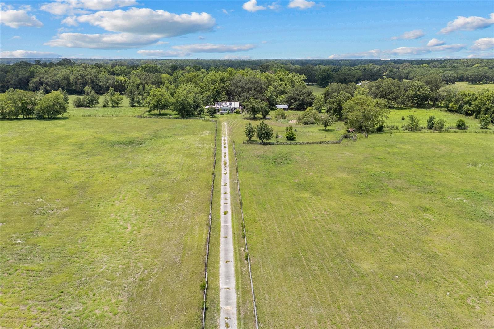 MAKE AN OFFER! Unlock the potential of this picturesque property, perfectly positioned just minutes from HCA, Shands Hospital, the University of Florida, Santa Fe College, and North Florida’s renowned state parks, rivers, and springs. Set against a backdrop of rolling landscapes and mature trees, this expansive 28.26-acre parcel offers a rare blend of serenity, convenience, and possibility. A beautiful drive-in entrance sets the tone with undeniable curb appeal and a peaceful, rural feel. Offered as-is, the existing structures provide a unique opportunity to restore and revive their timeless charm—or clear the canvas and build your dream. According to Alachua County guidelines, the land supports one dwelling per five acres, making it ideal for a family compound, private estate, multiple homesites, or a lucrative investment development.
Whether you're envisioning a quiet retreat, a legacy property, or a smart investment, this land holds the key to your vision. Don't miss your chance to own a piece of Florida's natural beauty and history.