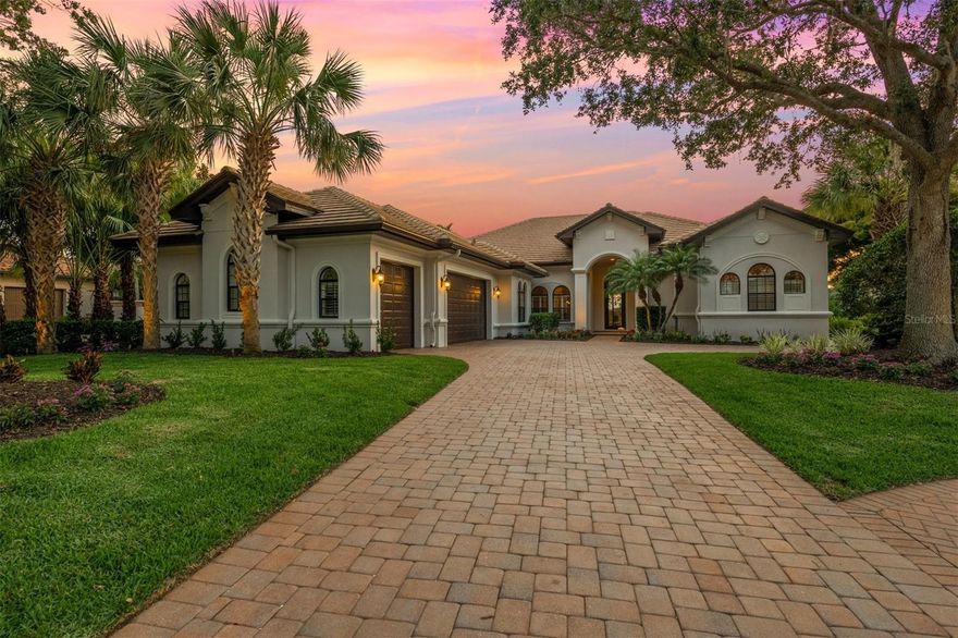 Under contract-accepting backup offers. Dream setting with incredible views! This exceptional home offers quality craftsmanship and spectacular indoor and outdoor living in one of Sarasota's most desirable neighborhoods. The Founder's Club is an enclave of only 262 homes and over 700 acres of protected preserve and wetlands. This is the neighborhood for those who desire a naturally gorgeous community with stately ancient oaks and those who appreciate architectural character. Nestled on a quiet and picturesque cul-de-sac homesite, this 4-bedroom + Study, 4.5-bath single-story home will inspire you to embrace true Florida living. Through the custom iron front door, a gracious living room offers a cozy ambiance with a fireplace and sweeping views of the lake and golf course. Tall ceilings with elegant details and wall to wall pocketing sliders across the back of the home provide glorious natural sunlight. The large great room transitions effortlessly to the outdoors and is built around the spacious kitchen with new classic white maple cabinetry and exquisite 'Taj Mahal' quartzite counters. The primary bedroom wing features abundant windows, a lovely sitting area, French door access to outside, two separate dressing rooms, and a spa bath with dual vanities and relaxing soaking tub. On the other side of the home, three large bedrooms offer privacy and space for family or guests to unwind. An executive office with built-in cabinetry showcases stunning views. Additional designer details include: tray ceiling details, plantation shutters, custom closet built-ins, new high-end carpeting in bedrooms, fresh exterior paint, and new landscaping. Outside, an expansive covered lanai with outdoor kitchen, fireplace, and large pool & spa is perfect for a private retreat or entertaining family and friends. Majestic sunsets make the incredible view even more special in the evenings. The Founders Club is a gated community in a prime location with close proximity to downtown Sarasota, shops and restaurants, and easy access to the lifestyle attractions of Lakewood Ranch including farmer's markets, polo games, and community events. 24/7 security guarded gate and optional social and golf memberships. Community clubhouse for social members with full restaurant, charming veranda, fitness center and coordinated events. Har-Tru Tennis courts, playground, and yoga classes for residents. The Robert Trent Jones Jr. golf course is a golfer's paradise and one of the region’s best and only walkable courses with easy tee-times. FEMA Non Flood Zone X. Front Gate is approximately 9 miles to downtown Sarasota. Schedule your private tour today to see this hidden gem and unparalleled neighborhood!