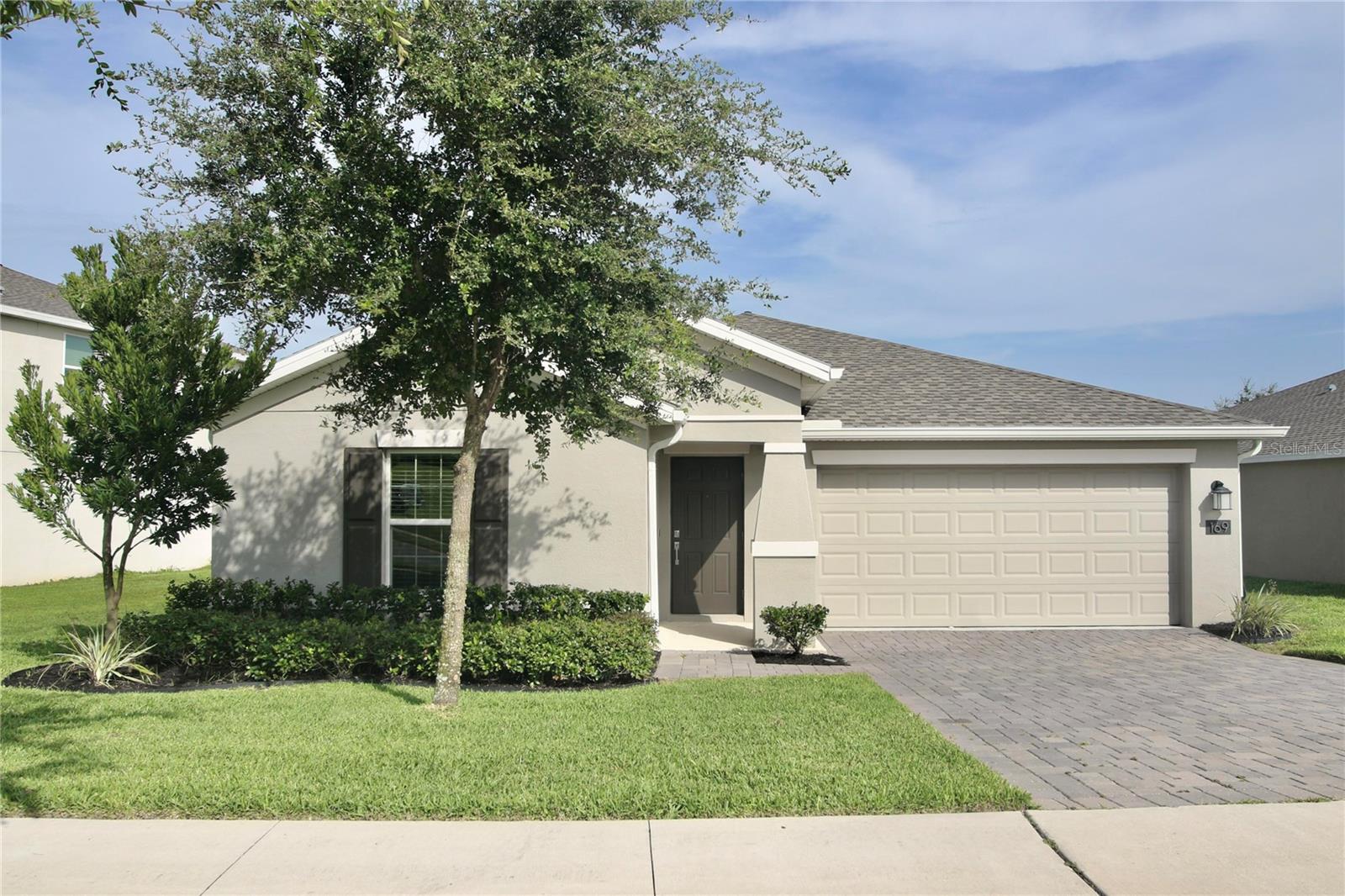 Built in 2021, this modern home has a blend of comfort, convenience, and privacy. Nestled on a lot that guarantees unobstructed views with no future development planned in front or behind.
Inside, you'll find a spacious open floor plan with vaulted ceilings that create a bright and airy atmosphere throughout. Ceramic tile flooring flows seamlessly through the main living areas, has both style and easy maintenance. The home’s split-bedroom layout provides added privacy, making it great for families or having guests. The heart of the home is the kitchen, featuring quartz countertops, modern appliances, a pantry for extra storage, and plenty of space for meal prep and entertaining.
The master suite is a true retreat, has a walk-in closet and a spacious en suite bathroom.
Beyond the interiors, enjoy the outdoors with easy access to neighborhood walking trails for peaceful strolls or outdoor exercise. You're also just a half mile from the newly built and expanding Cherry Lake Park as well as the brand-new Cherry Lake Academy. Plus, you’re only 10-15 minutes from the vibrant downtown areas of Groveland and Clermont, where you'll find shopping, dining, and entertainment options.
For commuters, the Florida Turnpike is just 15 minutes away, making travel a breeze.
Additional features of this home include a sprinkler system for a lush, well-maintained lawn, a 2-car garage, and an indoor laundry room.
Whether you're unwinding in the backyard, taking a walk on the trails, or enjoying the nearby parks, this home has a combination of tranquility and convenience that is hard to beat.