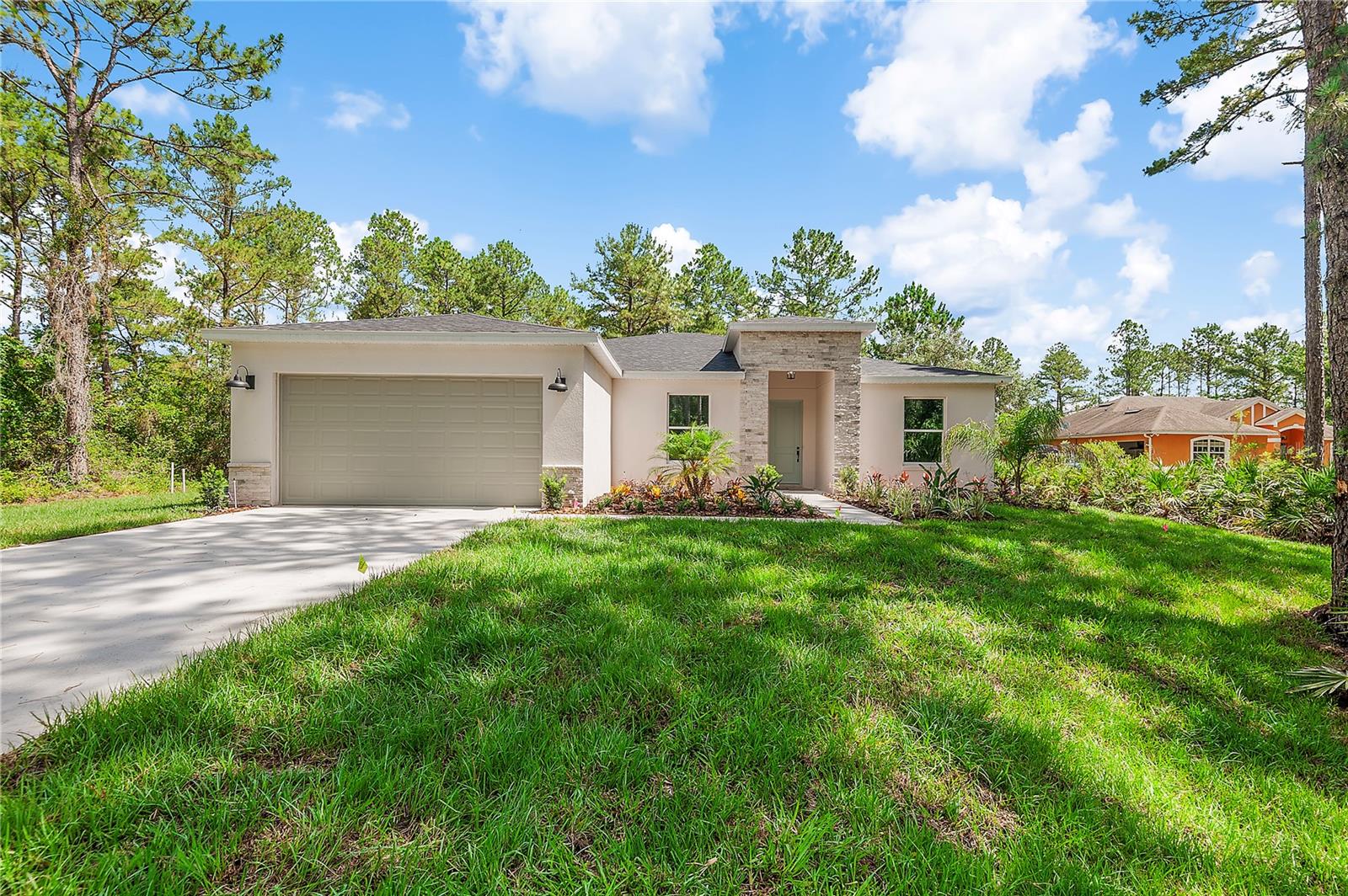 New Home on 1 Acre with Lake Access & Horse-Friendly Zoning. Builder is offering closing cost assistance with a full price over, or a permanent rate buy down when using their preferred lender.
Welcome to Royal Trails—a picturesque equestrian community in Eustis where natural beauty meets modern living. This 4-bedroom, 2-bath Royal Model by Eastern Homes is perfectly positioned on a 1-acre homesite and scheduled for completion in June 2025.
This is more than just a home—it’s a lifestyle. Bring your horses (up to two per acre allowed) and enjoy deeded access to Lake Norris, offering boating, fishing, and outdoor recreation just minutes from your doorstep.
Step inside to soaring 9’4” ceilings and an airy open-concept layout, featuring a spacious great room that flows effortlessly into the chef-inspired kitchen. Designed for both everyday living and entertaining, the kitchen showcases an oversized granite island with breakfast bar, 42” cabinets with crown molding, stainless steel appliances, and a walk-in pantry for optimal storage.
Triple sliding glass doors lead to a large covered lanai, creating a seamless indoor-outdoor living experience ideal for Florida’s climate.
Your private primary suite is a true retreat—complete with a tray ceiling, dual walk-in closets, and a spa-style en suite bathroom featuring dual granite vanities and a standalone shower. Three additional bedrooms are tucked away on the opposite side of the home, offering privacy for family or guests.
Additional highlights include:
Flexible formal dining area with abundant natural light
Split-bedroom floor plan for privacy and functionality
Generous mudroom and laundry space off the garage
Plenty of room for a workshop, garden, or future pool
Royal Trails residents enjoy a peaceful setting with access to a community center, playground, and miles of scenic horse and nature trails—all while remaining close to Downtown Eustis, shopping, dining, and major highways.
If you’re looking for new construction on acreage with freedom, flexibility, and a touch of country charm—this is it. Contact us today to schedule your private tour and make this slice of Florida paradise yours.