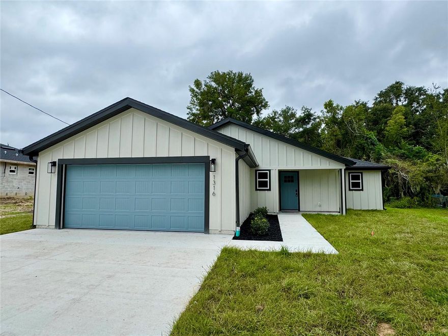 **NEWLY BUILT HOME - 2025**
Be the first to own this brand new 3 bedroom/2 bathroom new construction home.  This spacious, split plan 3 bedroom/2 bathroom home is equipped with all of the modern amenities & fixtures, at an affordable price!  Features include recessed lighting throughout, luxury vinyl plank floors, modern board & batten exterior, a spacious kitchen with quartz countertops, stainless steel appliances and glass tile backsplash.  This affordable luxury home has been outfitted with the most modern finishes and a high quality craftsmanship. You'll have peace of mind knowing this new construction home comes with brand new everything, including a 1-2-10 year warranty, backed by a local builder.

The kitchen features an island with a built in range and range hood, dishwasher, refrigerator, farmhouse sink, and an abundance of counter space. The brand new bathrooms feature fully tiled walls in the shower & tub and modern, rainfall shower heads & sprayers in each.  The primary bathroom features a double vanity & a linen closet. The laundry room & washer/dryer hook-ups are conveniently located just off the kitchen area. The home also boasts a 2-car attached garage.

This new home is energy efficient and equipped to mitigate the Florida heat with BAT insulation installed throughout the ceiling & walls of the living areas, including a fully insulated garage (ceiling & walls).  Each room has a ceiling fan and there is plenty of natural light throughout the home to compliment the recessed lighting in each room.

Owner is a licensed Realtor.

NOTE room sizes are approximate, it is the responsibility of the Buyer to verify room measurements