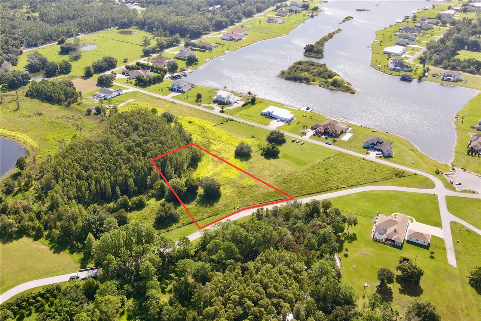 Outlaw Ridge offers seven spacious residential lots ranging from 1 to 1.88 acres, nestled within a private, gated community designed for custom-built homes. Located in a quiet and scenic setting, the community offers a peaceful atmosphere surrounded by nature
and is ideal for those seeking a quiet lifestyle.
The available lots include a mix of wetlands and floodplain areas. Many of the sites back up to wooded areas or designated conservation land, offering serene views and privacy. Utilities are well and septic.
The lots are located within Outlaw Ridge, a gated community, on Outlaw Way and Hideout Trail in Land O' Lakes in Pasco County. Outlaw Ridge is situated on Ehren Cutoff. Ehren Cutoff connects US 41 to State Road 52.
The site is approximately 10 minutes from US Highway 41, where nearby medical shopping, and schools are located. Additionally, it's 1.6 miles from State Road 52, 5.9 miles from I-75, and 7.6 miles from the Suncoast Parkway. The area offers a mix of rural and urban surroundings. Due to its proximity to major thoroughfares, it's just a short commute from Wesley Chapel (20 minutes), Dade City (25 minutes), Brooksville (30 minutes), New Port Richey (40 minutes), Tampa International Airport (40 minutes), downtown Tampa (40 minutes), and downtown St. Petersburg (50 minutes).