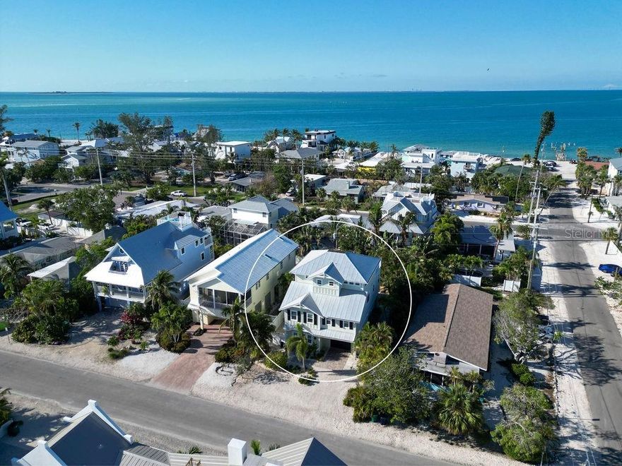 You are just a short walk to Beach and Bay from this quality constructed 4 bed/3 bath pool home with private elevator.  This ideally appointed property has multiple living rooms, large third floor porch with peeks of the water, dual zone air conditioning, open floor plan with spacious kitchen, Bosch appliances, custom lighting throughout, and covered pool deck in your private yard with mature landscaping.  The quiet street in the coveted North End of Anna Maria allows short term rentals and enjoys easy access to some of your island favorites, including Pine Avenue.   Storage abounds with two car garage space, ample cabinetry and custom closets.  You will love the abundant features of this beautiful home, including high ceilings, plantation shutters, and 18 inch tile and plank wood flooring.  Come enjoy the peace and serenity of this perfect island paradise!