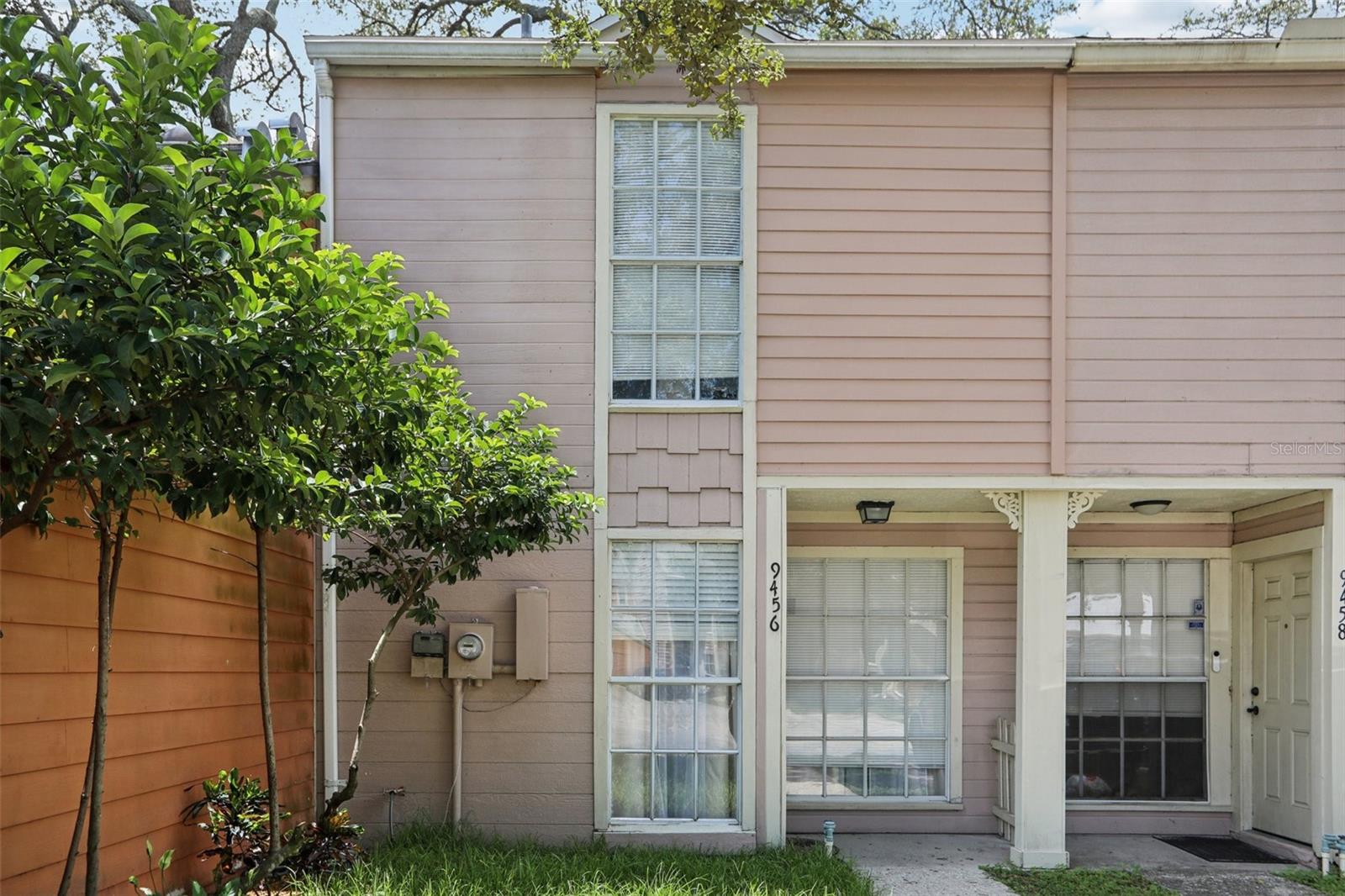Welcome to this bright 2-bedroom, 2.5-bath townhouse in Historical Forest Hills! This ready to move in home is in Flood Zone X. The main level features a half bath, open living area with a skylight, and impact-rated double-pane sliding doors that lead to a screened lanai and fenced backyard with a large storage closet. Upstairs you'll find two bedrooms, the primary suite with en-suite bath, and a second full bath for the generously sized second bedroom. Full set of appliances: range, refrigerator, dishwasher, microwave, washer, and dryer. Assigned parking for two cars sits right in front of the unit. This pet-friendly community offers a pool, and the HOA covers water, cable, internet, and lawn care. Recent updates include a new roof (2021) and water heater (2022). You're just minutes from W Busch Ave, N Blvd, N Rome Ave, N Armenia Ave, Babe Zaharias Golf Course, Lowry Park, Busch Gardens, Raymond James Stadium, shopping, dining, and the airport. Easy to show with a SupraBox on site, book your tour today via ShowingTime!