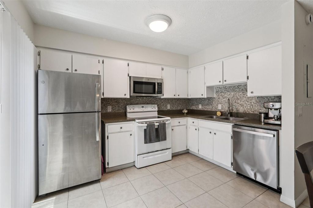 Photo of 9456 Forest Hills Circle, Tampa, FL 33612 (MLS # TB8412329)