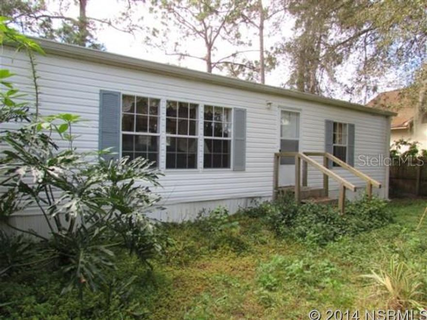 Location gives this property value and potential for new use. Access road off Newton Rd brings you to the back of the manufactured home. Property also fronts Central Park Blvd. 93'x 230' lot. Great place to build a new home. Current mobile home includes all appliances and furnishings. Split bedroom for plan. Spacious living room has cathedral ceiling, eat-in kitchen has breakfast bar & nook, inside laundry room, large master bedroom with walk-in closet and a 11'x 8' bathroom that has a double sink vanity, garden tub and shower stall. 2nd & 3rd bedrooms also have walk-in closets. 2nd full bathroom has tub. Kitchen sliding glass doors lead out to 20'x 20' patio. Also includes a storage shed.Huge 1/2 Acre lot with a 1996 mobile home in great location. Walking distance to All Children's Park, Tennis Courts, Baseball Fields, and Neighbor's Ice Cream Store. Zoning allows for single family homes, so you could buy with a view to build your future home. Also available MLS # 1019722 - 575 Newton Rd (home located behind this one). Both lots will give you an acre property. ;Water: City