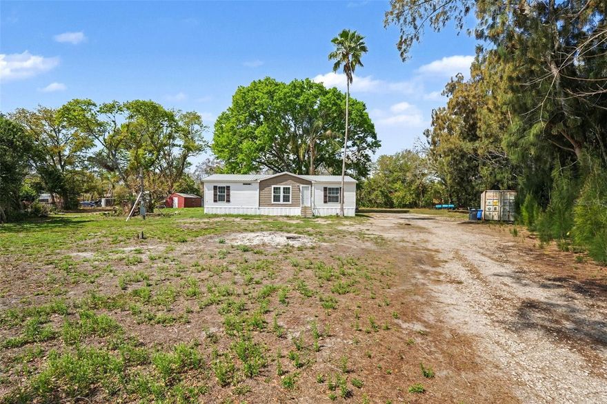 Welcome to your new home! This well-maintained 3-bedroom, 2-bath manufactured home built in 2024 sits on a spacious and serene lot, offering privacy, space, and the freedom of rural living while still being within easy reach of town conveniences. Step inside to an open-concept living area filled with natural light, seamlessly connecting to the large kitchen featuring ample cabinet space, a center island, stainless steel appliances, and a large double sink perfectly positioned beneath a window. The cozy dining area provides an inviting space for family meals or entertaining guests. 

The primary suite offers a private retreat with a dual-sink vanity, walk-in closet, and a spacious walk-in shower in the en-suite bathroom. An interior laundry room adds everyday convenience. Upgraded crown molding, baseboards, and recessed lighting throughout the home create a clean, modern feel. Two additional bedrooms offer flexibility for guests, a home office, or a growing family. Step outside and enjoy over ¾ of an acre of open space, perfect for gardening, a play area, RV parking, or even adding a future workshop. Whether you're looking to escape the city or start a small homestead, this property offers endless possibilities. Schedule your private showing today and experience the peaceful lifestyle this home has to offer.