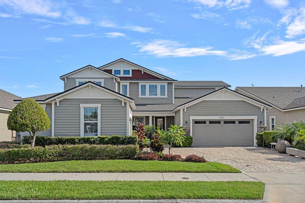 Welcome to 14897 Ellingsworth Lane – A Spacious Retreat in Gated Oxford Chase
Tucked away on a quiet cul-de-sac in the sought-after gated community of Oxford Chase, this stunning 5-bedroom, 4-bathroom home with a flex space ideal for a home office offers the perfect balance of elegance, function, and location. Built in 2018, the home features an open-concept layout, soaring ceilings, and a long list of upgrades designed for today’s modern lifestyle.
From the moment you arrive, you’ll be drawn in by the lush landscaping, paver driveway, and welcoming covered front porch. Inside, enjoy dramatic two-story ceilings, abundant natural light, and designer fixtures—including crystal and chrome chandeliers in both the formal dining room and the second dining area off the kitchen.
At the heart of the home, the spacious kitchen boasts shaker cabinetry, quartz countertops, a large island, walk-in pantry, stylish backsplash, natural gas stove, and stainless-steel appliances—all opening to the generous family room, perfect for entertaining or relaxing.
The thoughtfully designed split floor plan features a serene primary suite on one side of the home, complete with a spacious bedroom, his-and-her walk-in closets, and a spa-like en-suite bath with dual vanities, soaking tub, and walk-in shower. A second en-suite bedroom on the opposite wing offers privacy for guests or multigenerational living.
Two additional downstairs bedrooms provide versatility, and one of them is currently used as a home office. Both larger bedrooms feature walk-in closets, while the stylish powder room adds convenience near the main living areas.
Upstairs, a large open loft provides flexible space for a TV room, homework area, or playroom, alongside two more bedrooms—one with new carpet, the other with luxury vinyl plank flooring—and a full bath.
Additional features include:
Three-car garage (2-car plus separate 1-car currently used as a gym)
Tile flooring throughout the main living areas
Wide luxury vinyl plank flooring in most bedrooms
Ceiling fans throughout
Laundry room on the first floor with both gas and electric dryer hook-ups
Optional water softening system
Security system, window blinds, and natural gas connection
Expansive backyard ready for outdoor entertaining
Community playground and dog park
The location is unbeatable— very close to A-rated Sun Ridge Elementary and Sun Ridge Middle School, so you’ll never sit in car lines again! You’re also just minutes from Tucker Ranch, Winter Garden Village, historic Downtown Winter Garden, and Oakland, with easy access to Avalon Road and major highways.
With its prime location, spacious layout, and luxury finishes, this home truly has it all. Don’t miss the opportunity to make 14897 Ellingsworth Lane your next address.