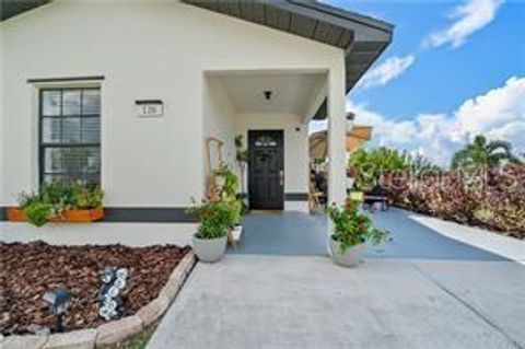 Photo of 126 Palmetto Circle NE, Port Charlotte, FL 33952 (MLS # C7515412)